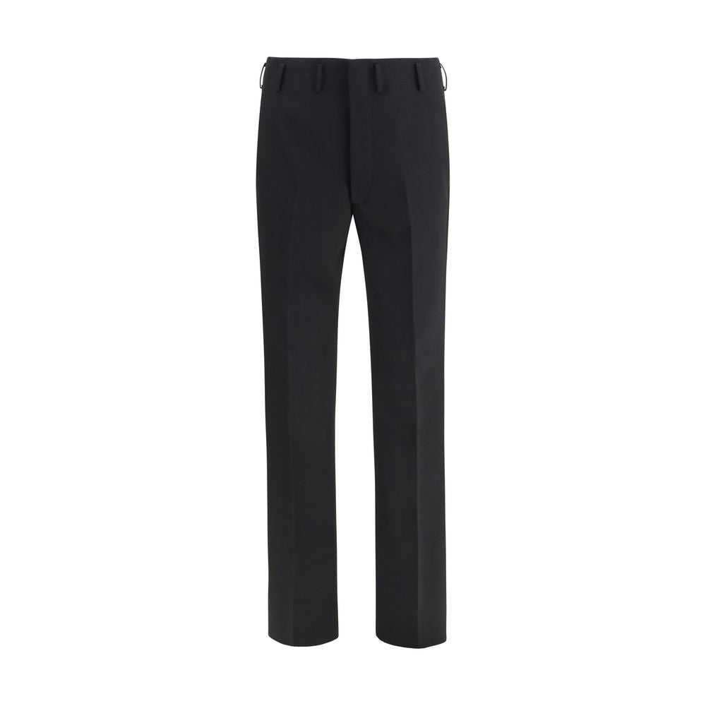 Experience the exquisite allure of Prada Black Wool Oves Aries Dress Pants, crafted from luxurious fleece wool for a timeless elegance that redefines sophistication.
