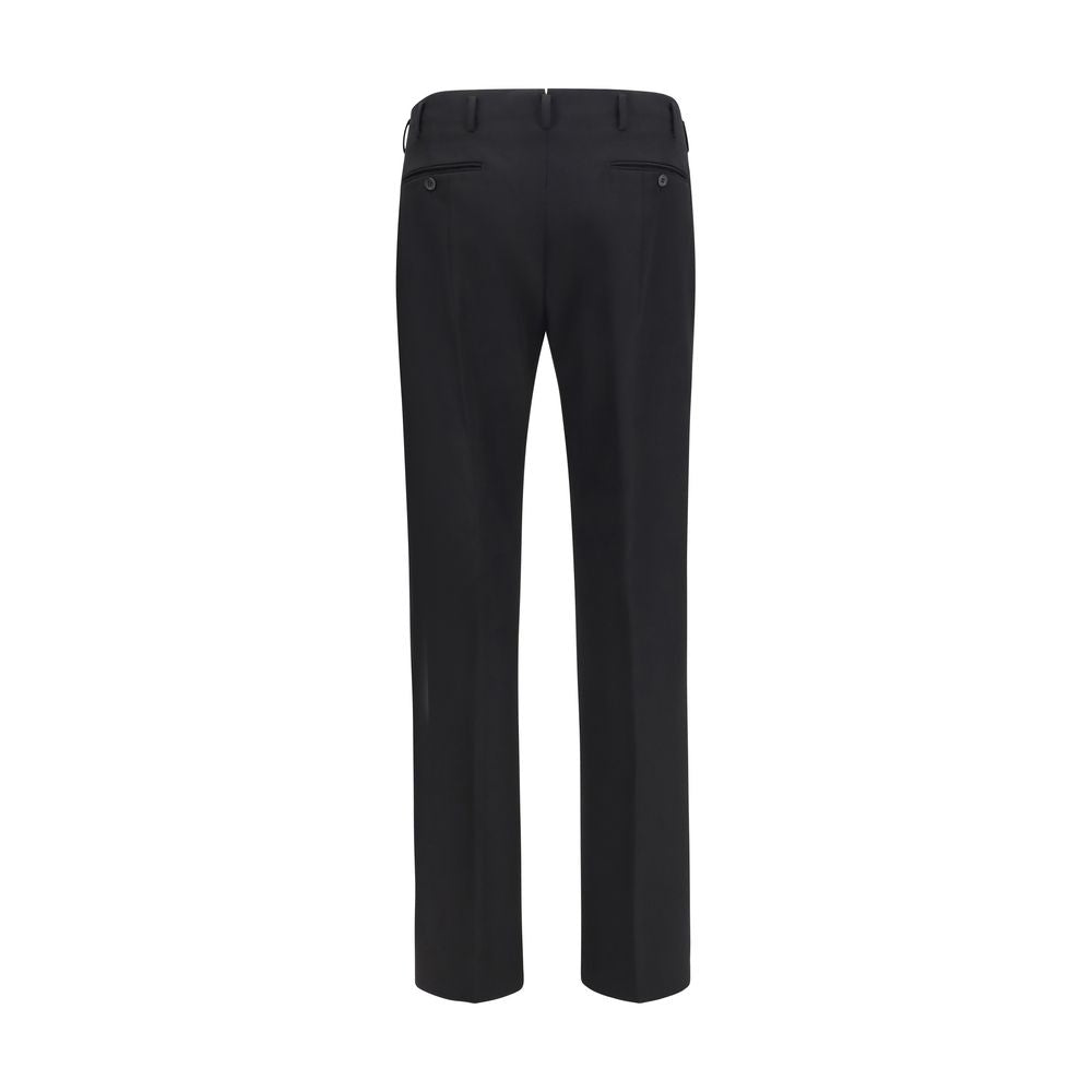 Discover the Prada Black Wool Oves Aries Dress Pants, crafted from luxurious fleece wool for timeless elegance, perfect for the discerning individual who values sophistication.