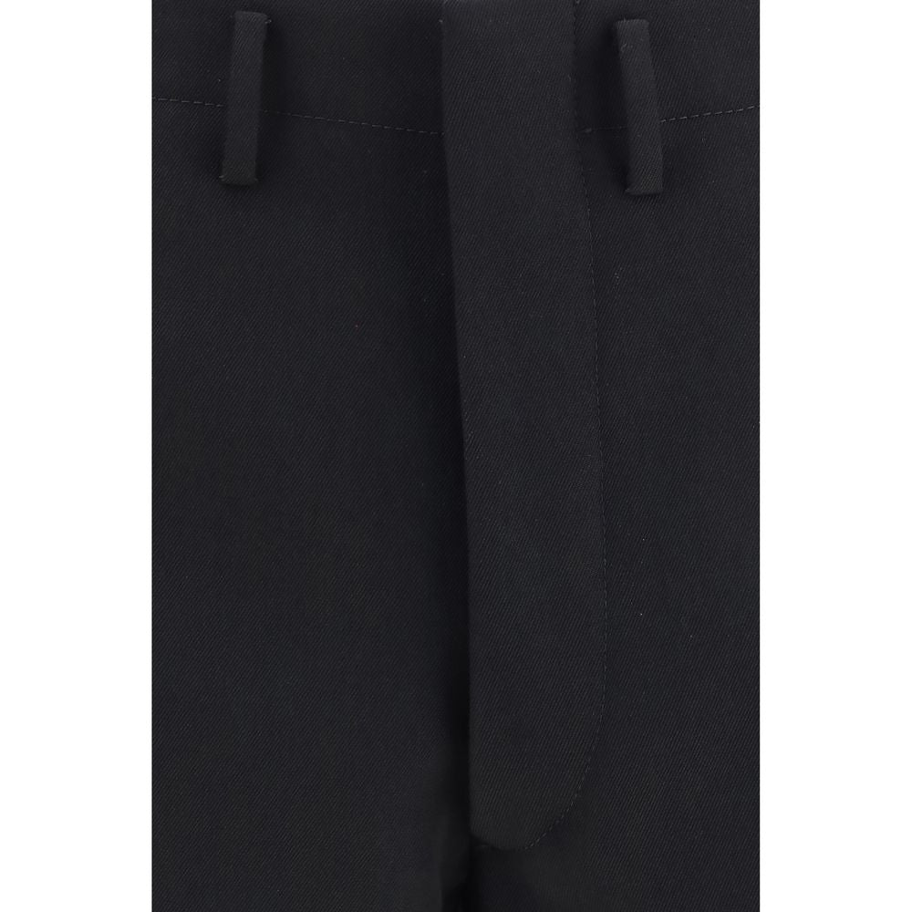 Experience the allure of Prada's Black Wool Oves Aries Dress Pants, crafted from luxurious fleece wool for timeless elegance and sophisticated versatility.
