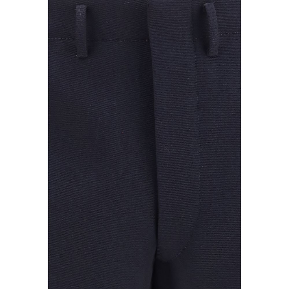 Experience the allure of Prada Blue Wool Oves Aries Dress Pants, crafted from luxurious fleece wool, embodying sartorial excellence for the discerning individual.