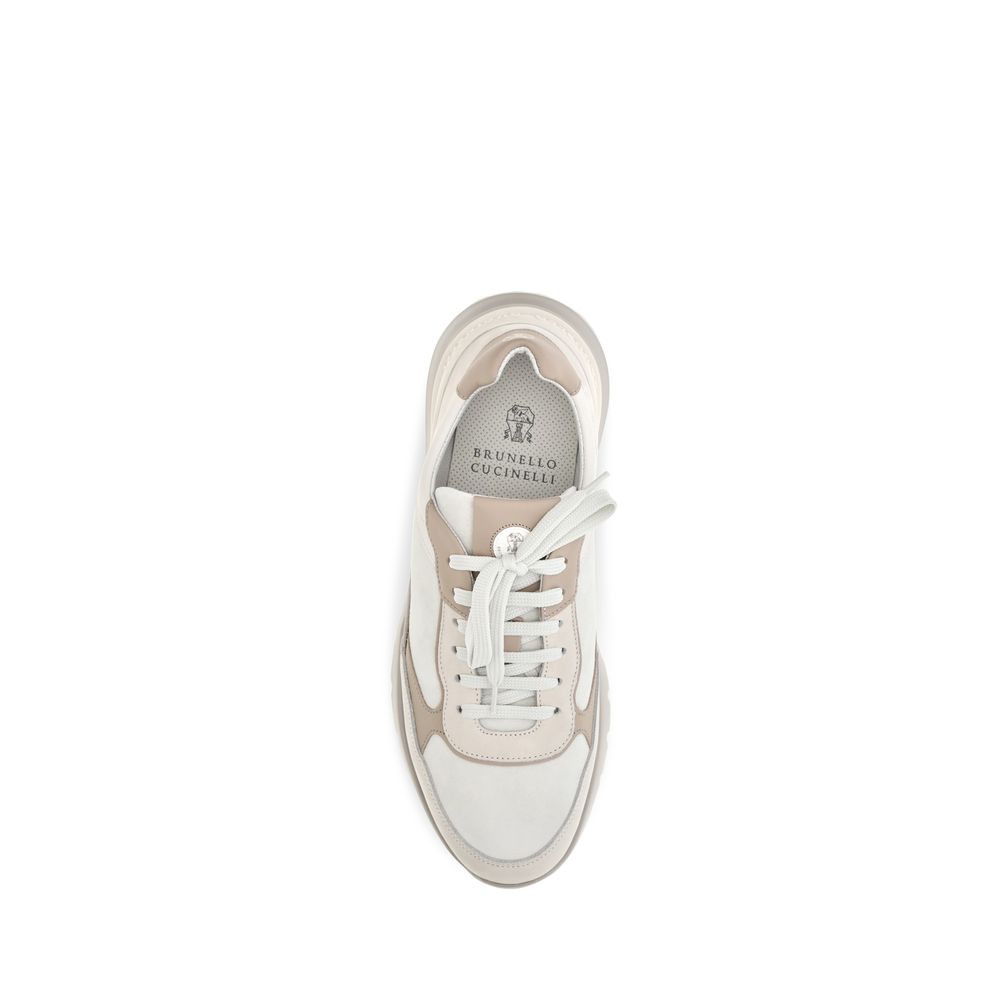 Elevate your style with Brunello Cucinelli's Beige Calf Leather Bos Taurus Athletic Sneakers, where refined craftsmanship meets luxurious comfort for the discerning individual.