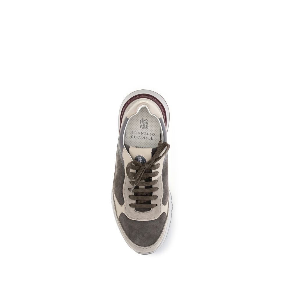 Indulge in the exquisite Brunello Cucinelli Gray Calf Leather Bos Taurus Chunky Sneakers, where refined craftsmanship meets luxurious comfort for the modern connoisseur.