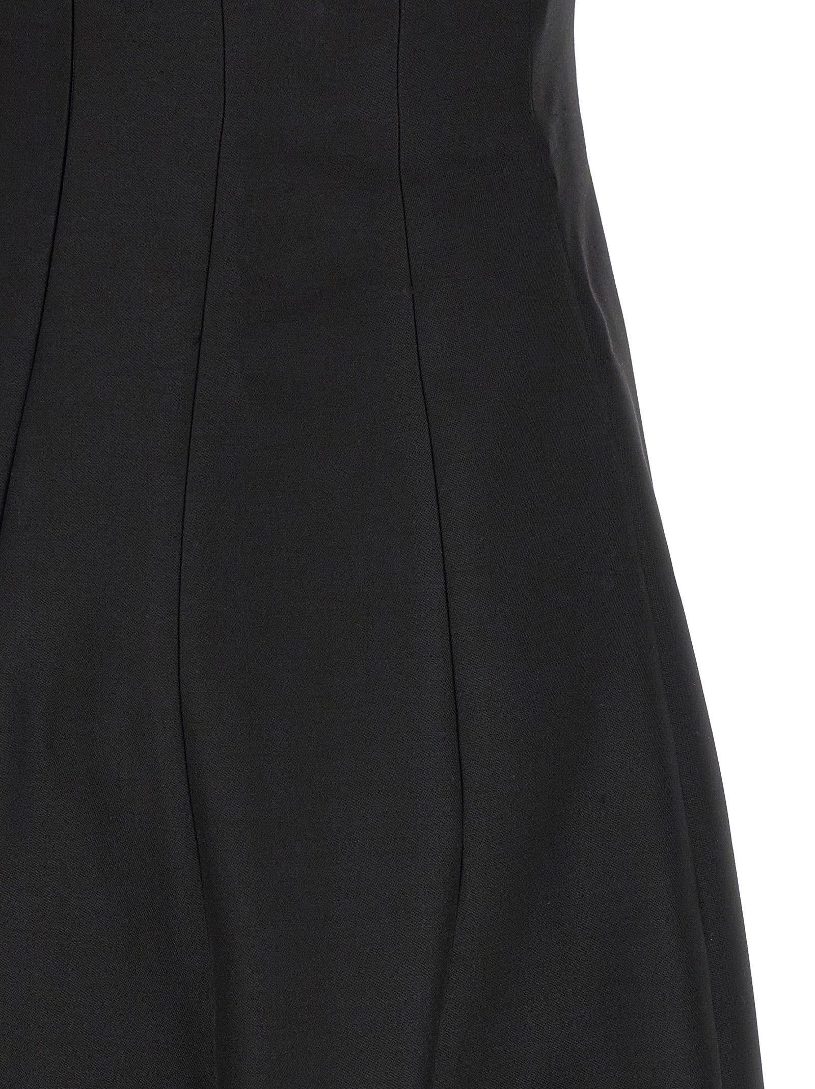 Experience the sculptural elegance of the Khaite Black Wool Long Dress, a luxurious blend of fine wool and silk, designed for those who command attention and exude sophistication.
