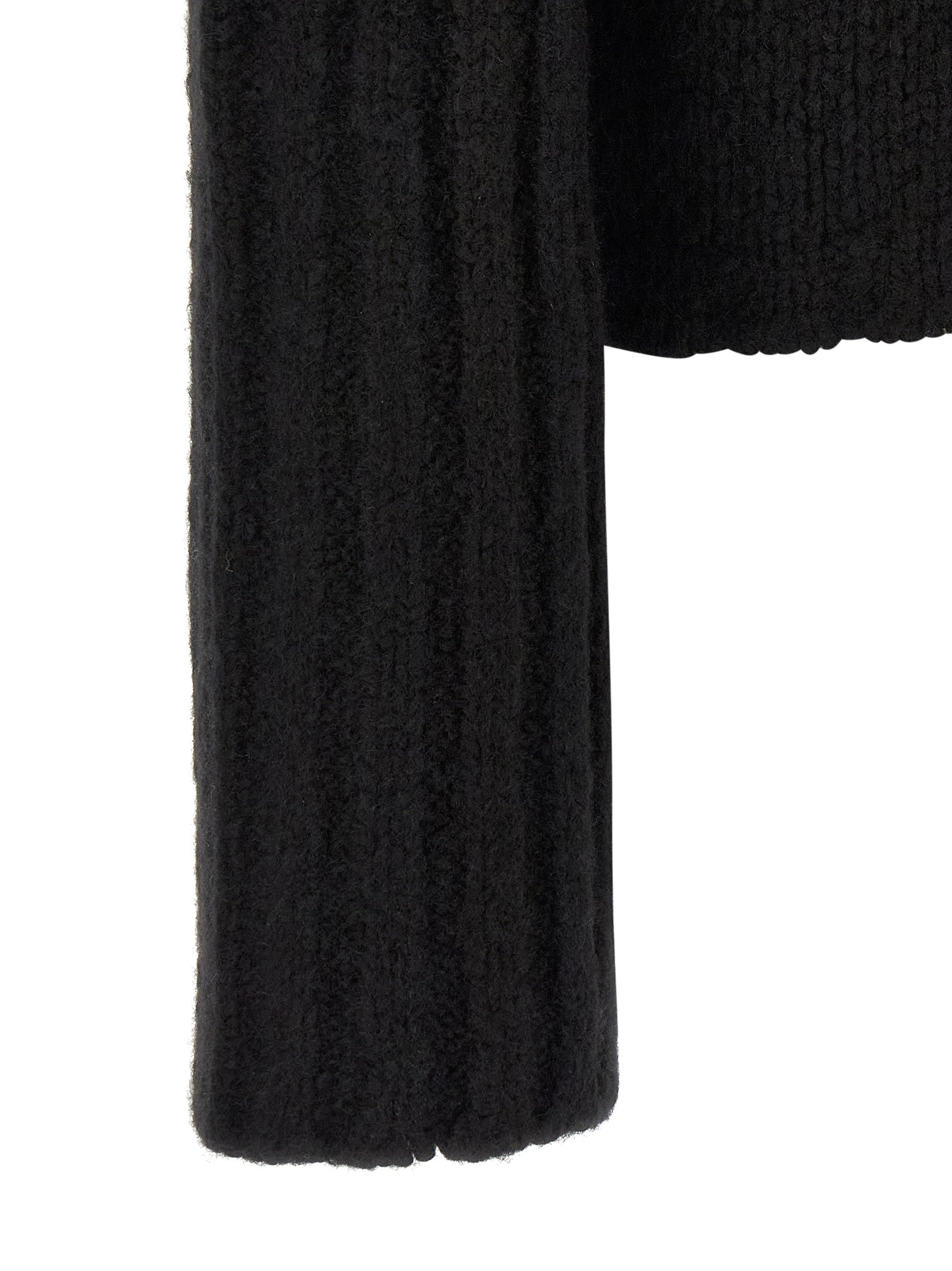 Elevate your wardrobe with the Rick Owens Black Cashmere Cardigan, a luxurious blend of cashmere and silk, embodying timeless elegance and sophisticated allure.