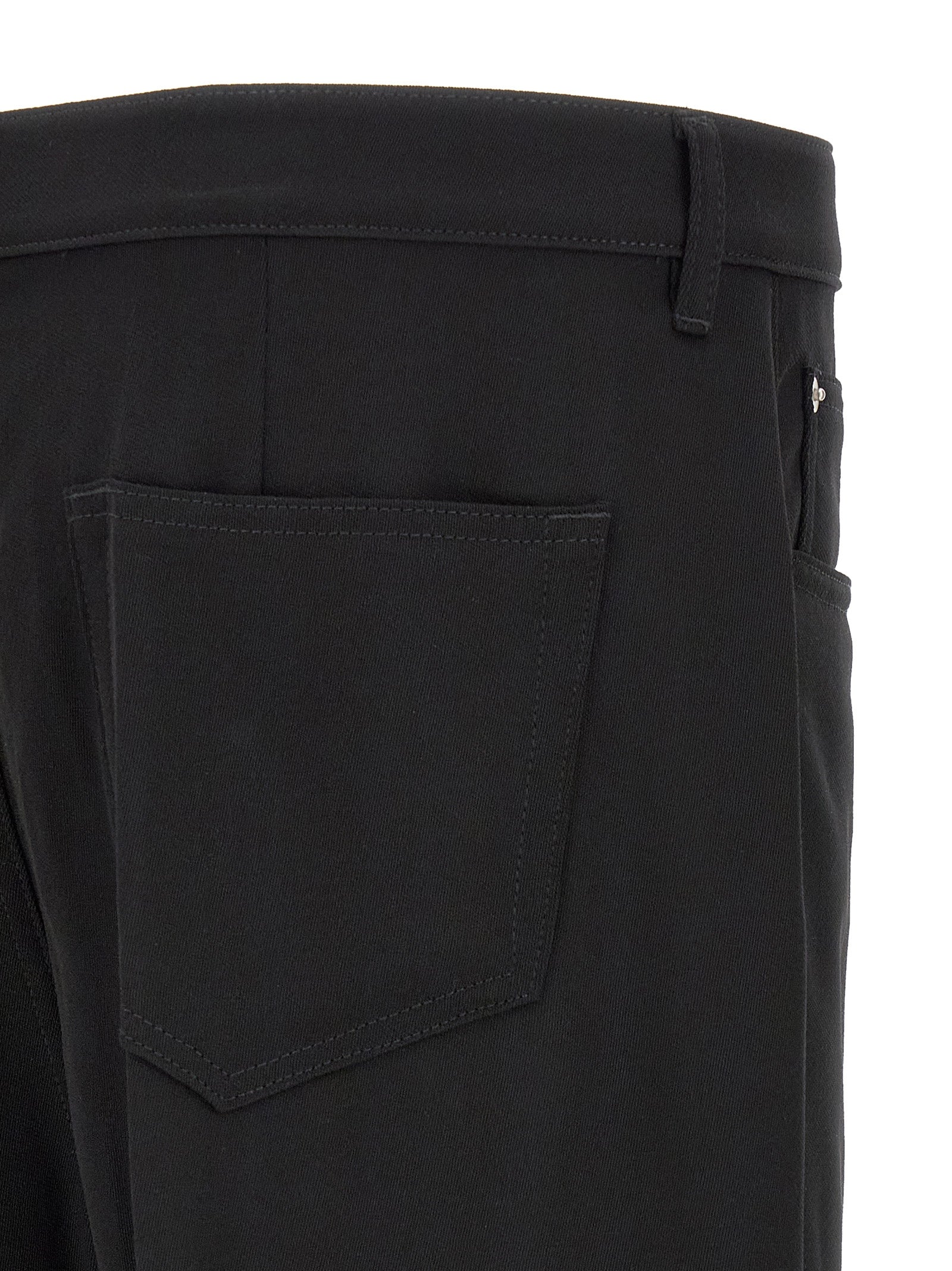Indulge in the exquisite craftsmanship of Rick Owens Black Cotton Relaxed Fit Jeans, where modern minimalism meets luxurious comfort for the discerning individual.