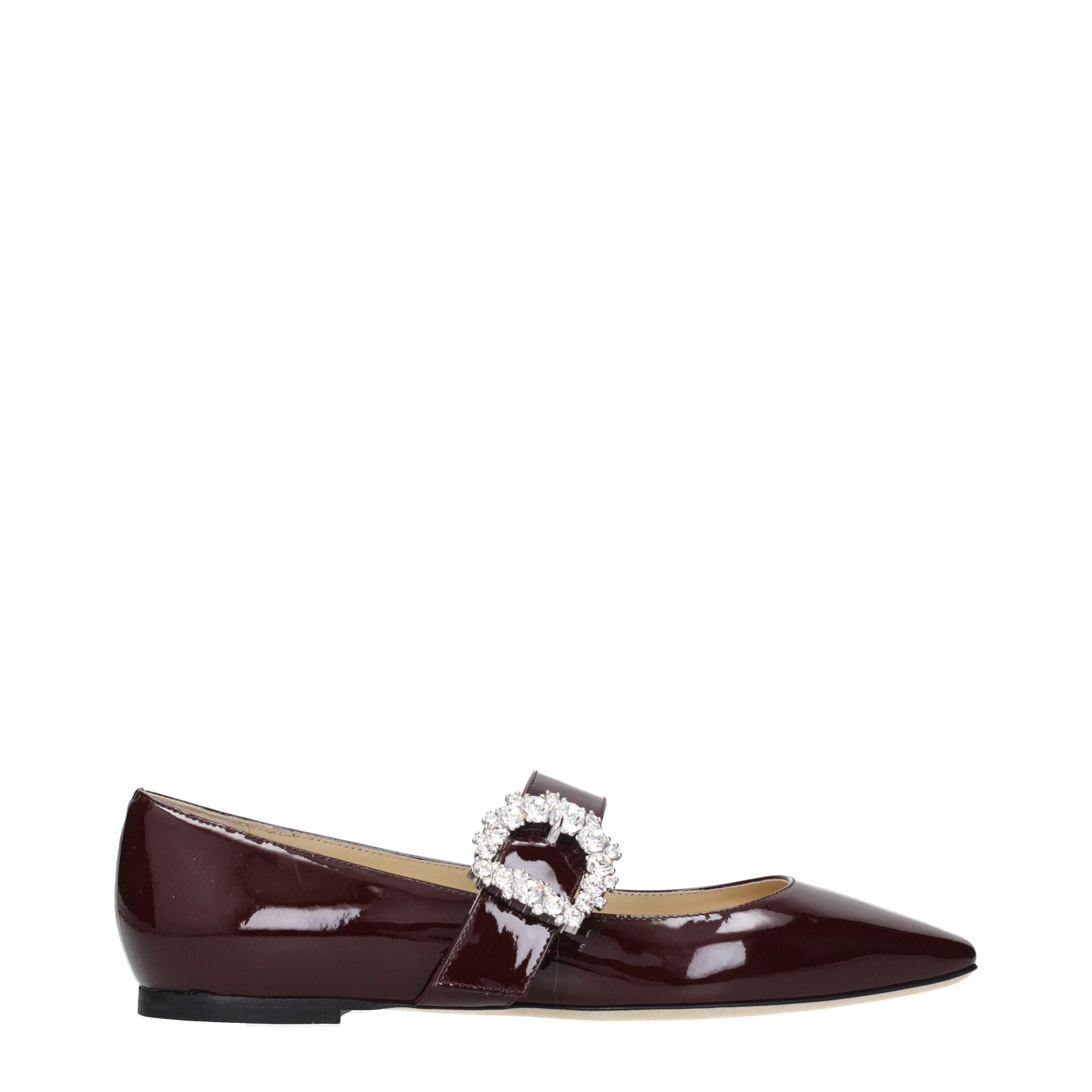Indulge in the allure of Jimmy Choo Red Leather Ballet Flats, where exquisite patent leather meets radiant rhinestone detailing, embodying timeless elegance and sophistication.