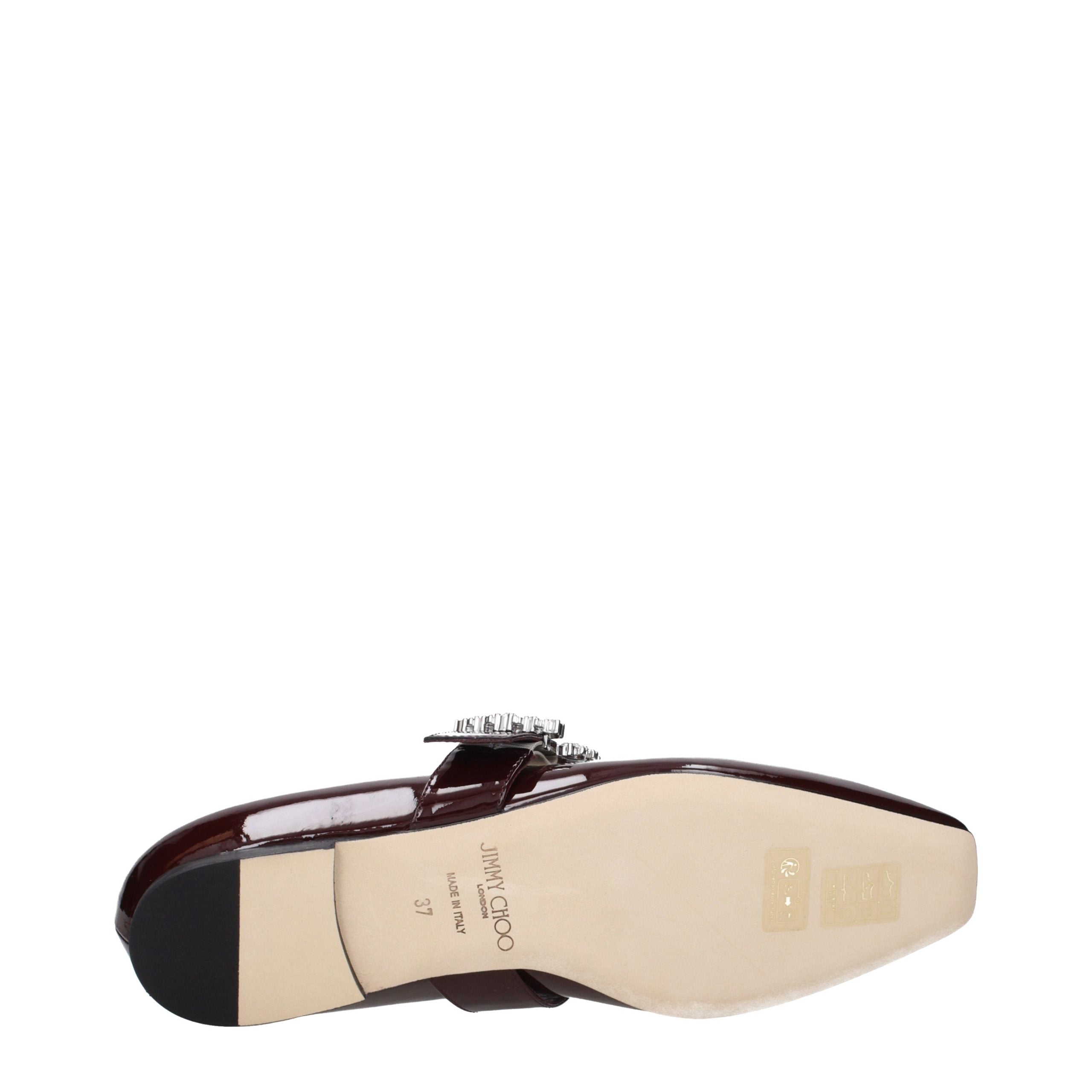Indulge in the timeless elegance of Jimmy Choo Red Leather Ballet Flats, crafted from luxurious patent leather with exquisite rhinestone detailing, perfect for any sophisticated wardrobe.