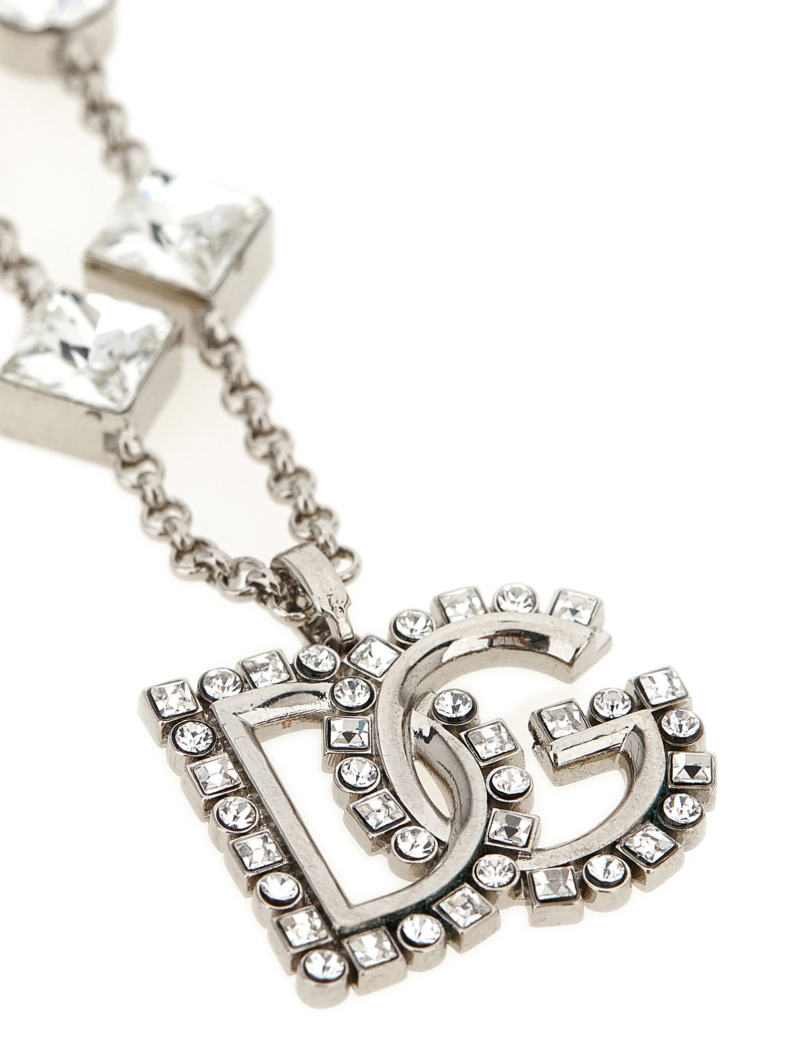 Discover the Dolce & Gabbana Silver Brass Necklace, a masterpiece of Italian craftsmanship adorned with shimmering stones, perfect for elevating any ensemble with timeless elegance.