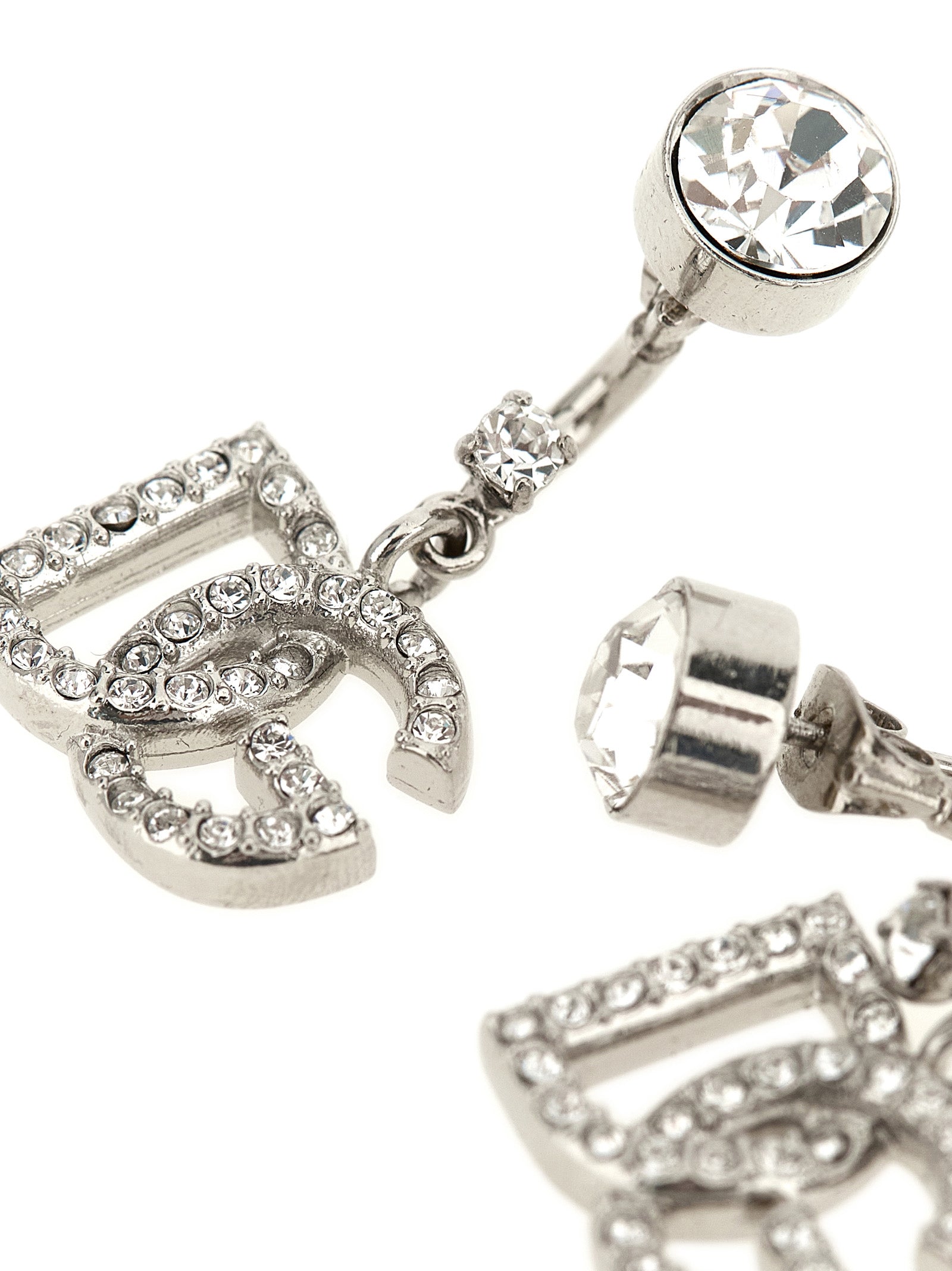 Elevate your elegance with Dolce & Gabbana Silver Brass Earrings, a masterpiece of Italian craftsmanship adorned with shimmering crystals, perfect for any sophisticated occasion.