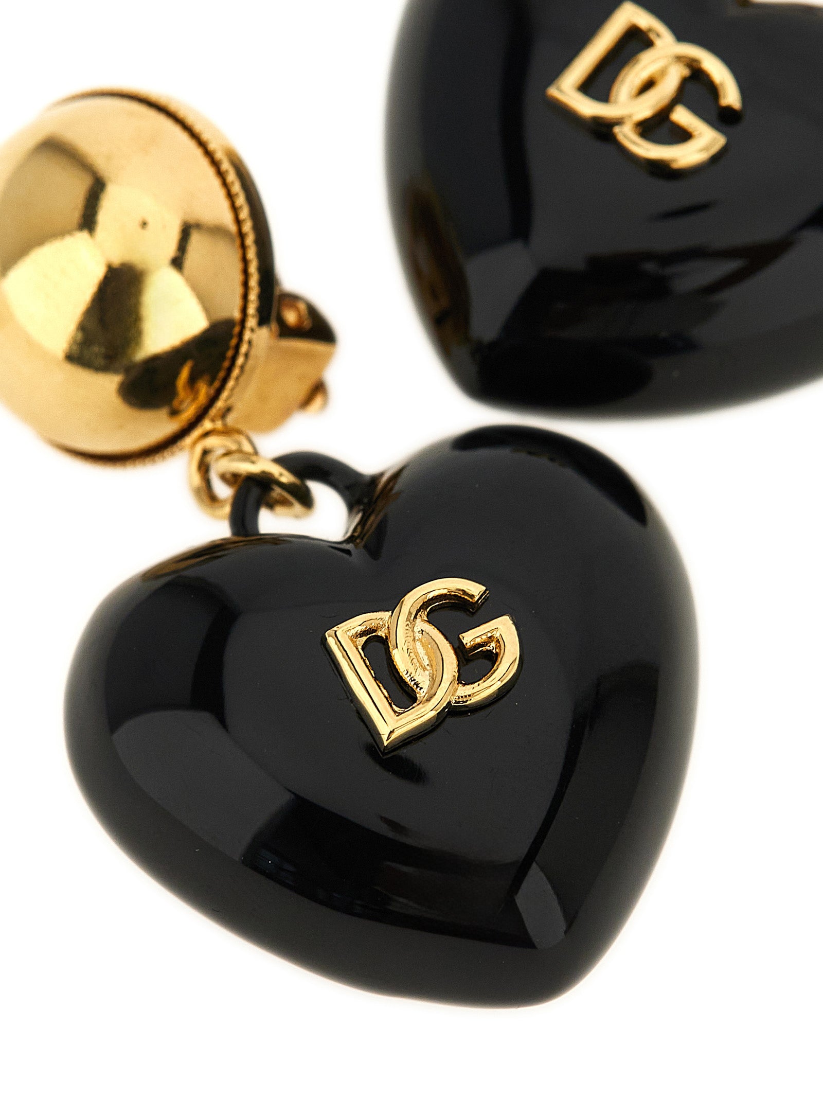 Elevate your elegance with Dolce & Gabbana Black Brass Earrings, featuring a striking heart-shaped design that embodies sophistication and timeless allure.