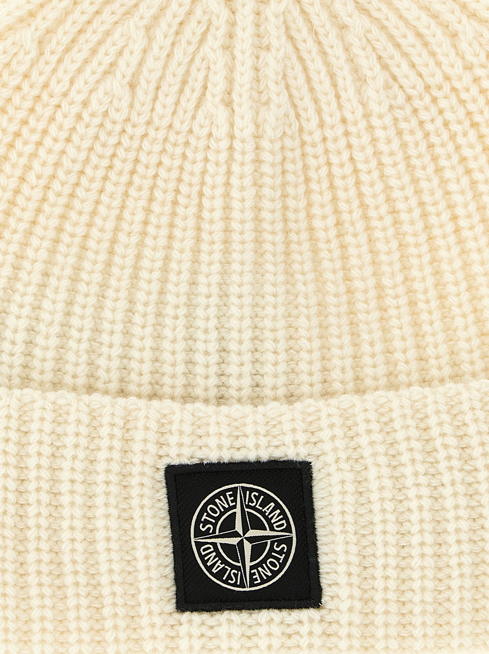 Elevate your winter wardrobe with the Stone Island White Virgin Wool Beanie, a luxurious blend of Geelong RWS wool, designed for those who value both warmth and style.