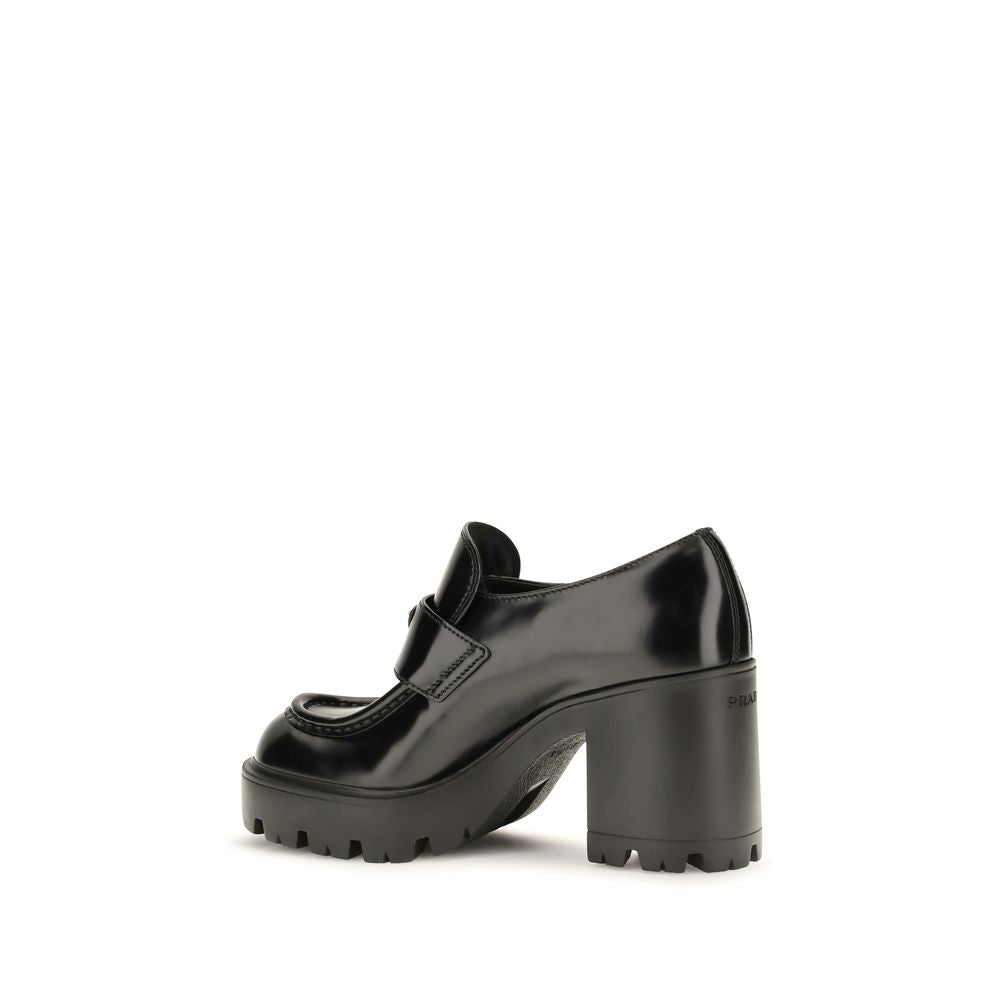 Indulge in the exquisite Prada Black Calf Leather Bos Taurus Platform Loafers, where luxurious craftsmanship meets elevated style, perfect for the discerning connoisseur.
