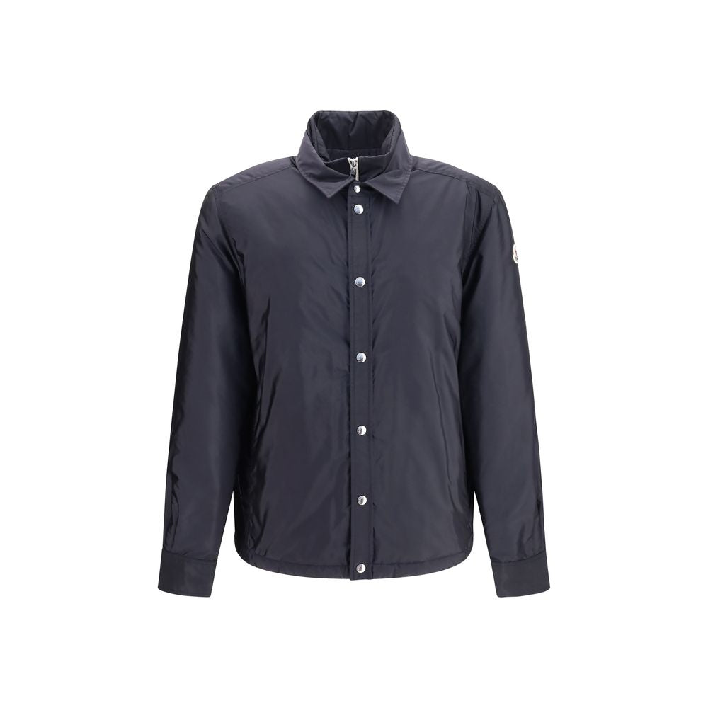Discover the Moncler Blue Polyamide Shell Jacket, a fusion of recycled technical nylon and luxurious down filling, epitomizing refined elegance and sustainable style.