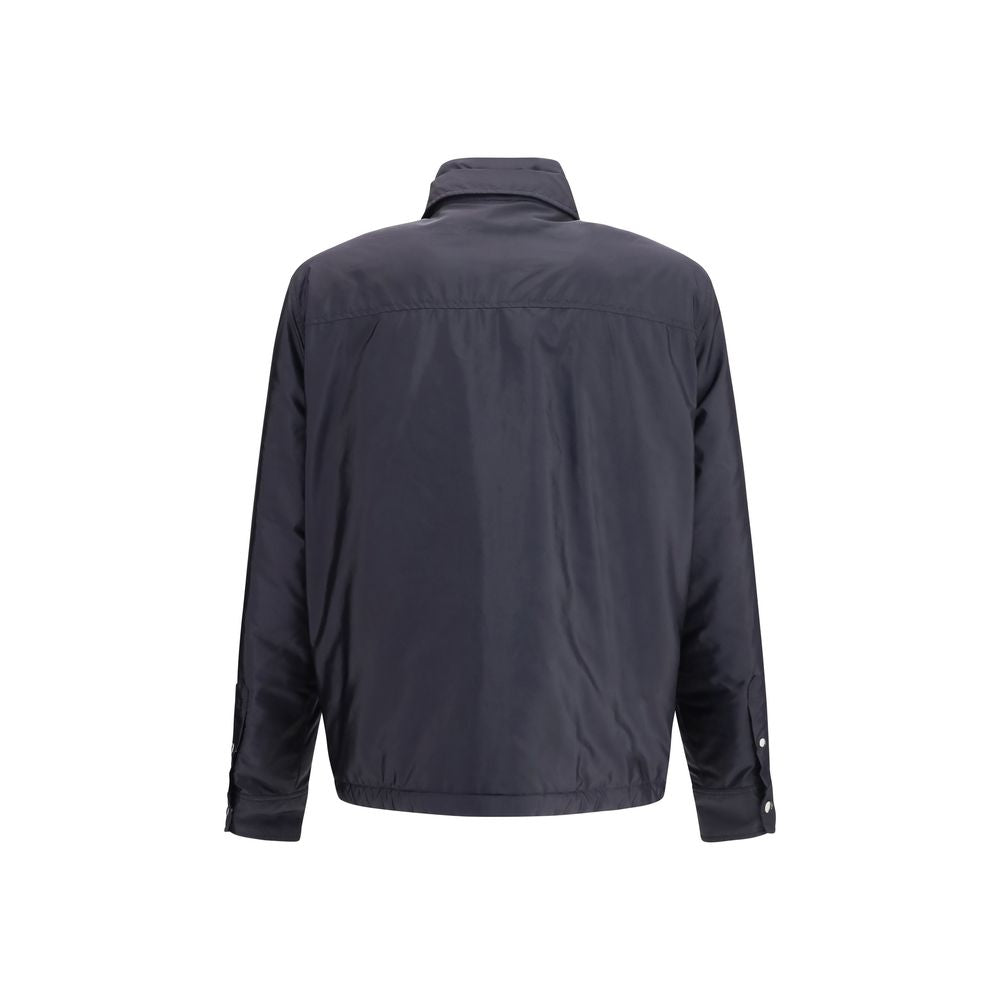 Discover the Moncler Blue Polyamide Shell Jacket, a masterpiece of recycled nylon and down filling, exuding elegance and sophistication for the discerning individual.