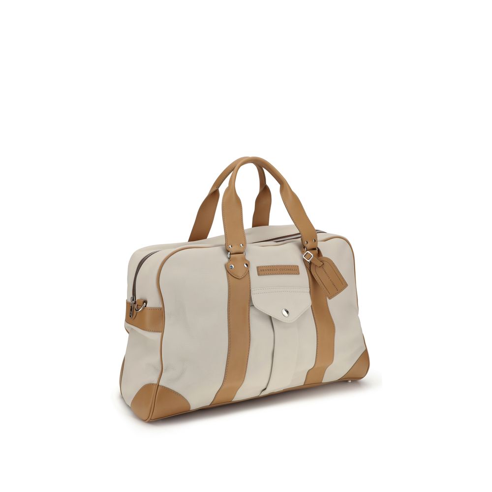 Experience the allure of Brunello Cucinelli's Beige Calf Leather Bos Taurus Luggage, a masterpiece of craftsmanship designed for discerning travelers seeking sophistication.