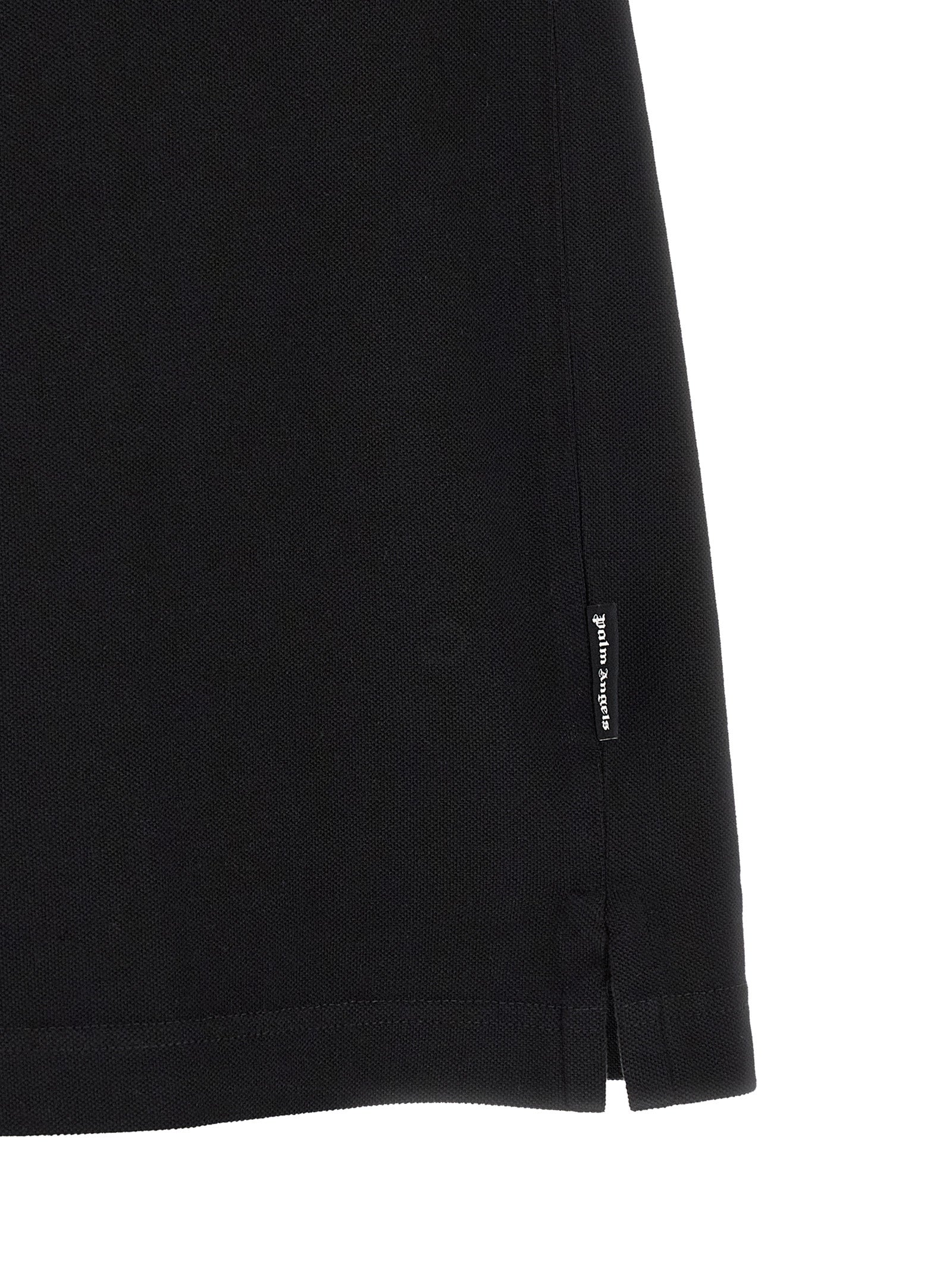Discover the Palm Angels Black Cotton Polo Shirt, a masterful blend of sophistication and streetwear elegance, crafted from premium cotton for the discerning wardrobe.