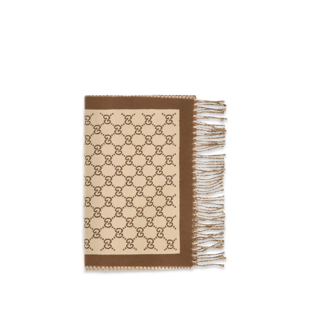 Indulge in the Gucci Beige Wool Oves Aries Scarf, a luxurious 100% Merino wool masterpiece, showcasing exquisite craftsmanship and timeless elegance for the discerning individual.