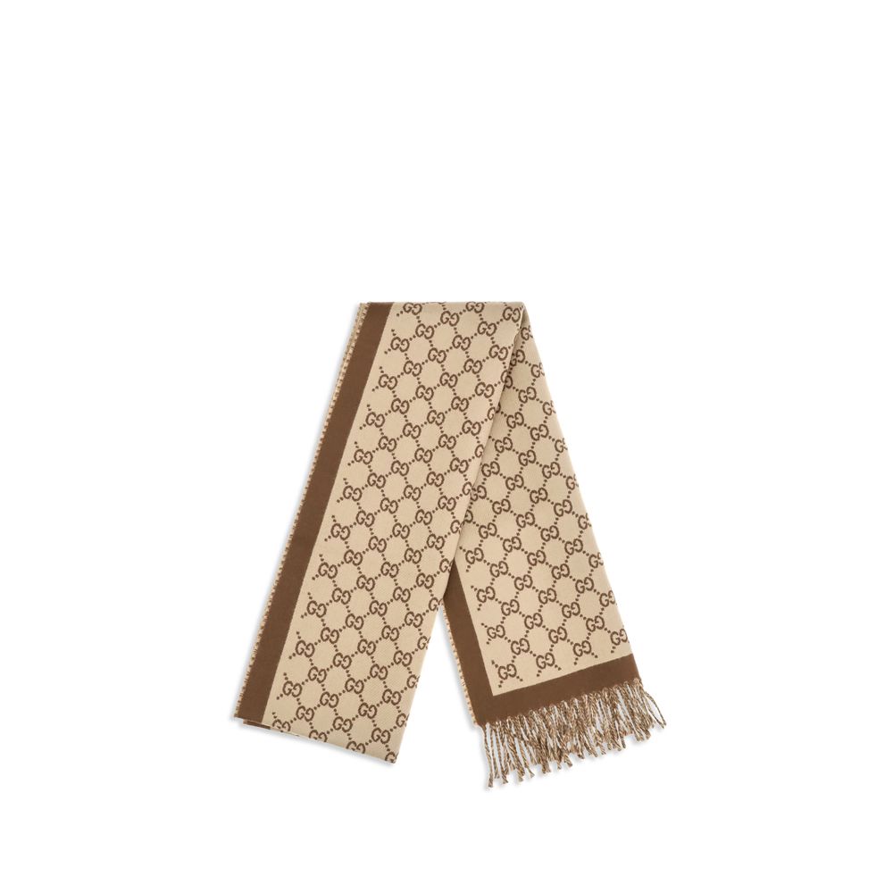Indulge in the exquisite Gucci Beige Wool Oves Aries Scarf, crafted from 100% Merino wool, embodying timeless luxury and sophistication for the discerning individual.