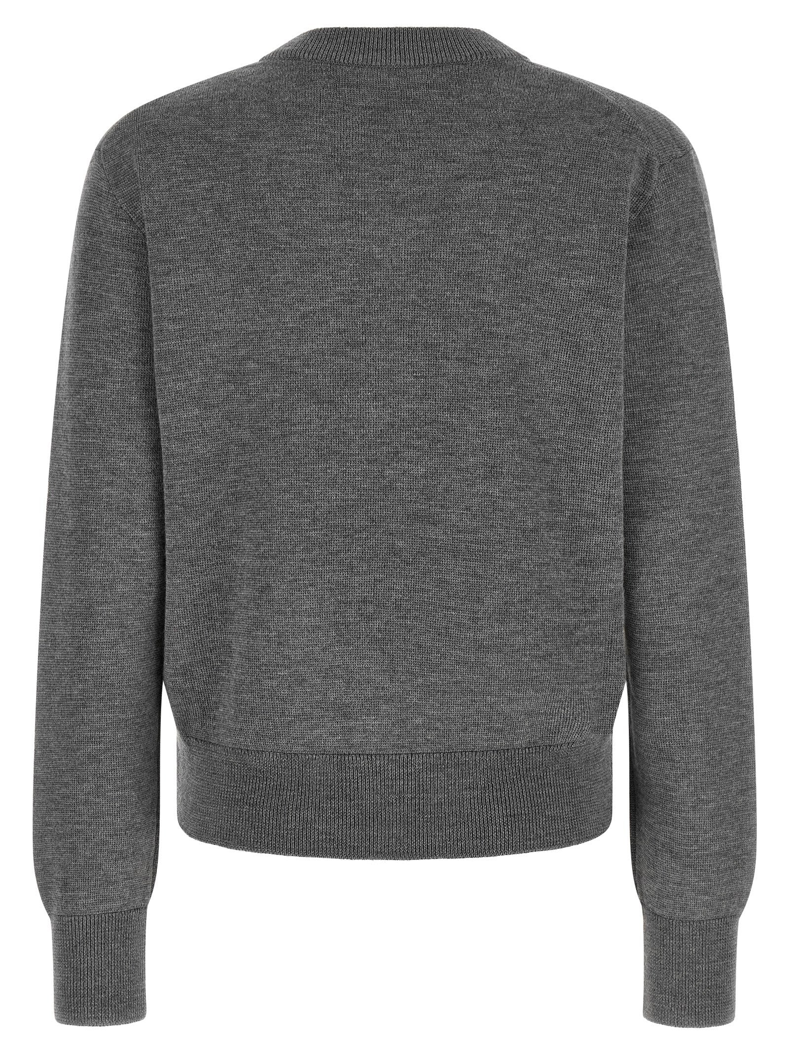 Indulge in the Ami Paris Gray Wool Cardigan, a masterpiece of 100% wool craftsmanship that embodies timeless elegance and sophistication for discerning tastes.