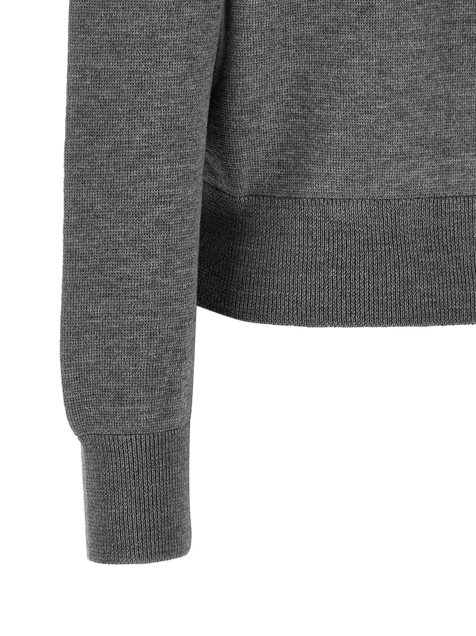 Indulge in the Ami Paris Gray Wool Cardigan, a timeless piece of luxurious craftsmanship, expertly crafted from 100% wool, embodying sophistication and elegance for every occasion.