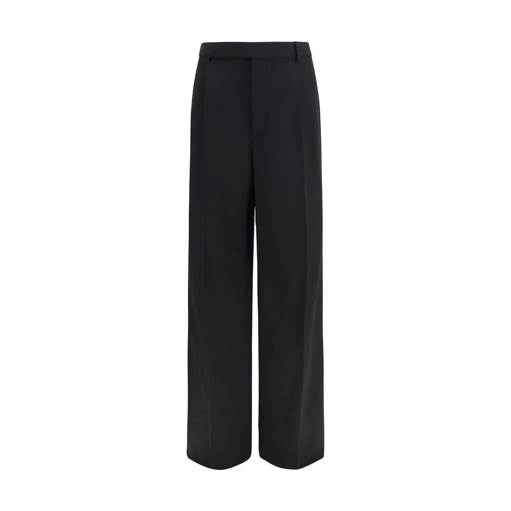 Experience the epitome of sophistication with Saint Laurent's Black Wool Oves Aries Dress Pants, crafted from luxurious 100% Wool Ovis Aries for timeless elegance.