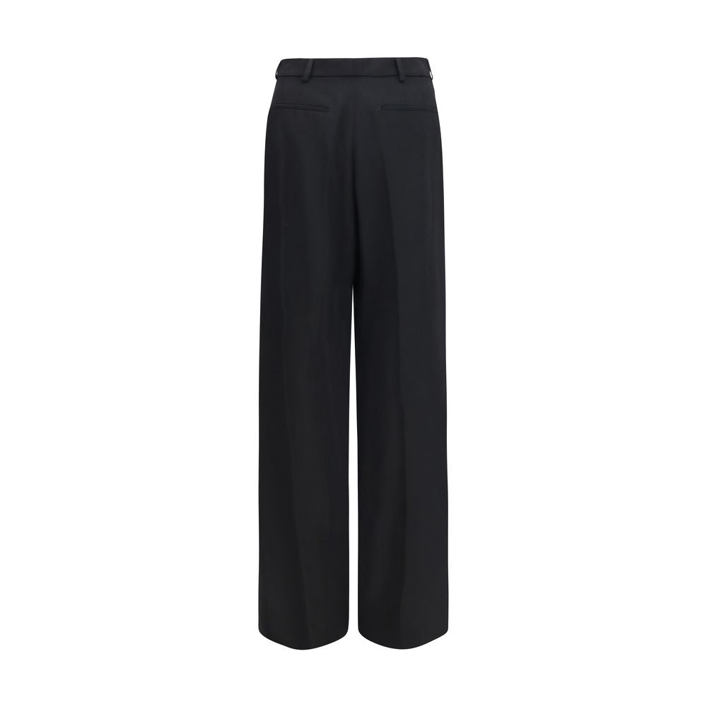 Experience the epitome of sophistication with Saint Laurent's Black Wool Oves Aries Dress Pants, crafted from exquisite 100% Wool Ovis Aries for timeless elegance.