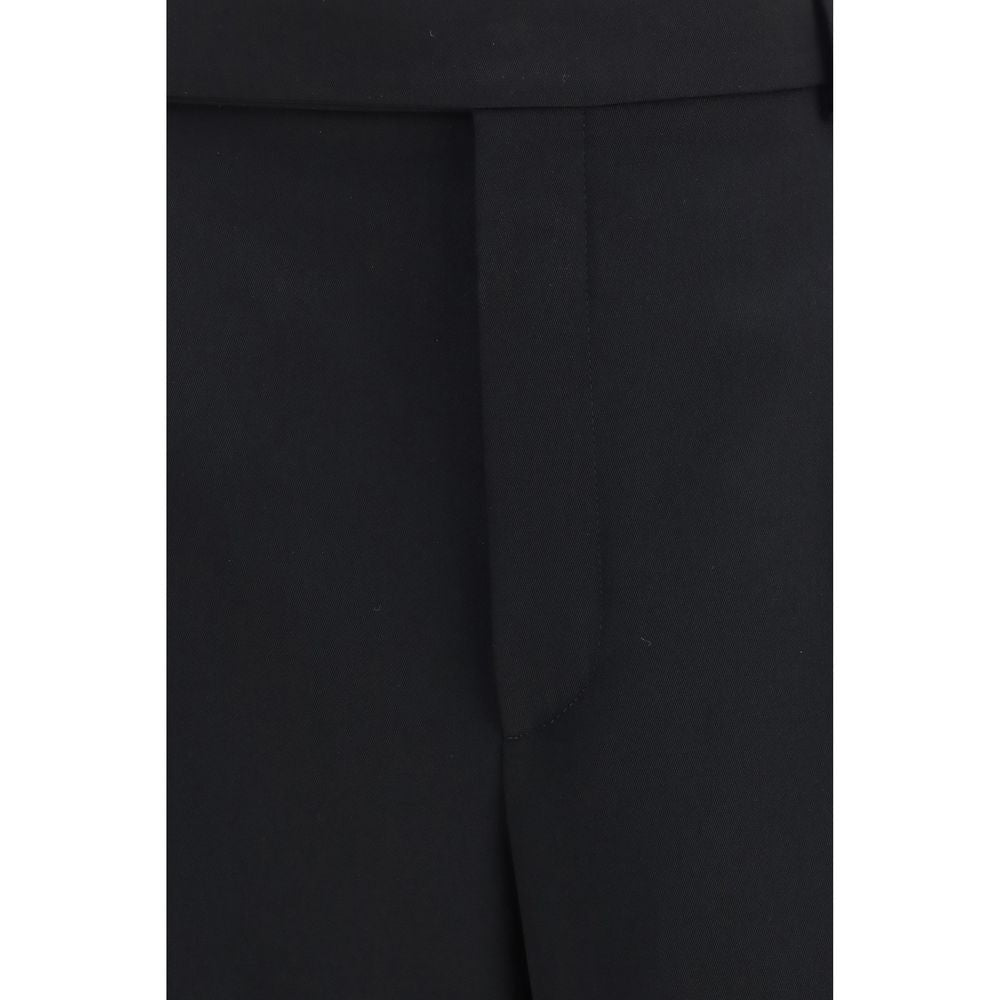 Experience the timeless elegance of Saint Laurent Black Wool Oves Aries Dress Pants, crafted from luxurious 100% Wool Ovis Aries for the discerning individual.