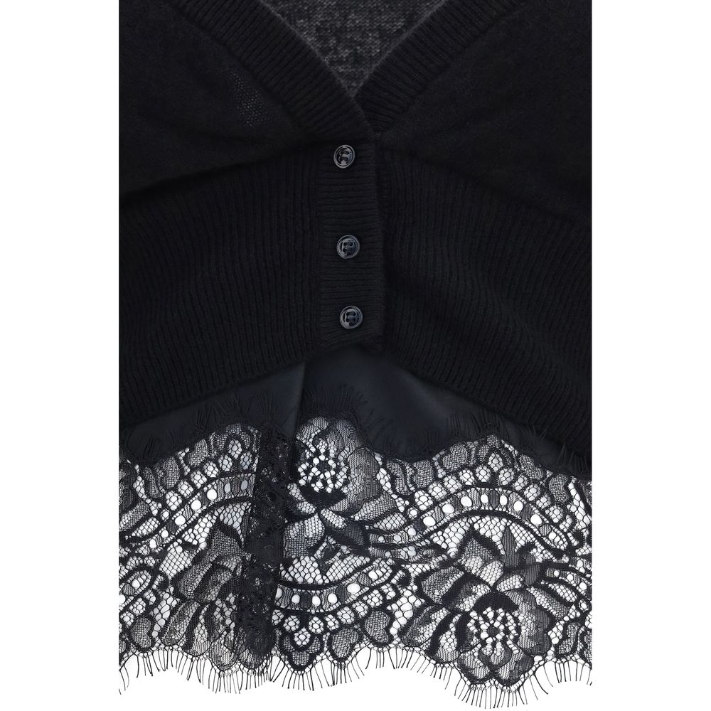 Experience the allure of the Ermanno Scervino Black Cashmere Cardigan, a masterpiece of layered elegance and exquisite craftsmanship, perfect for the discerning individual.