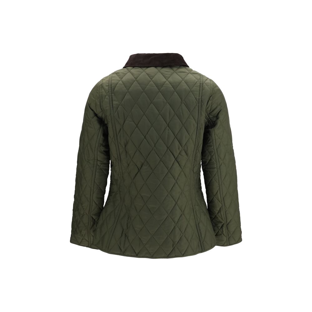 Discover the Barbour Bicolor Polyamide Shell Jacket, a blend of iconic diamond quilting and luxurious materials, perfect for those who appreciate refined outdoor elegance.