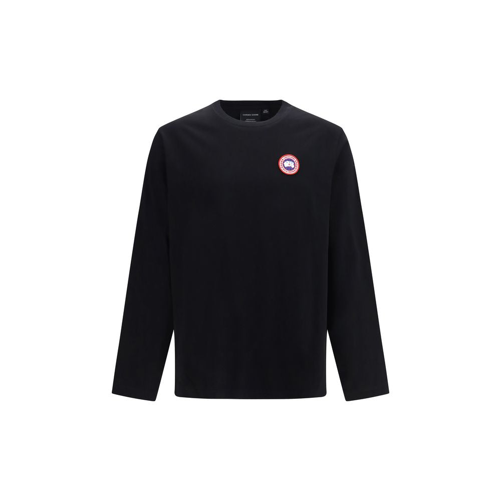 Discover the Canada Goose Black Cotton Long Sleeve T-Shirt, crafted from luxurious organic cotton jersey, a timeless piece that embodies sophistication and effortless style.