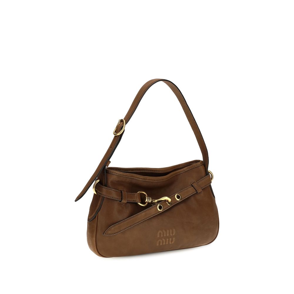 Elevate your style with the Miu Miu Brown Lamb Ovis Aries Aries Shoulder Bag, a masterpiece of haute couture craftsmanship designed for the discerning individual who embraces luxury.