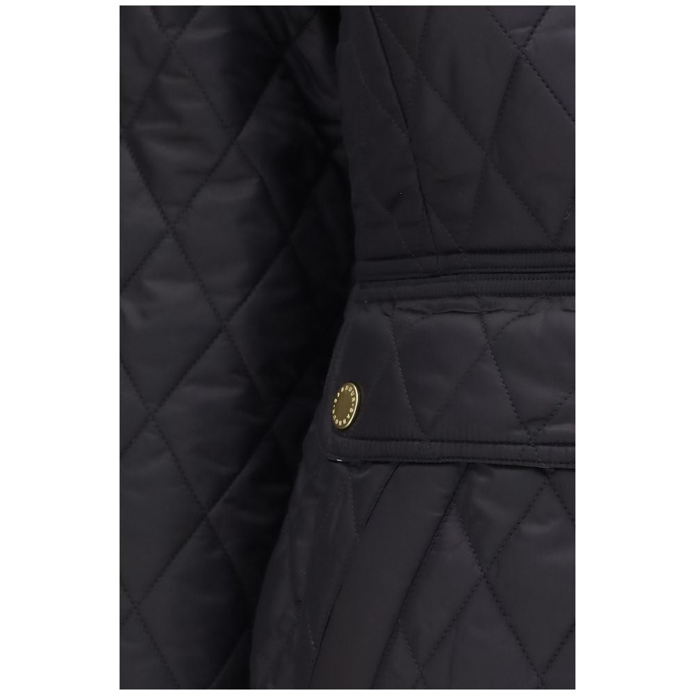 Elevate your wardrobe with the Barbour Black Polyamide Full-Length Jacket, a luxurious blend of style and warmth, featuring exquisite diamond quilting and an iconic corduroy collar.