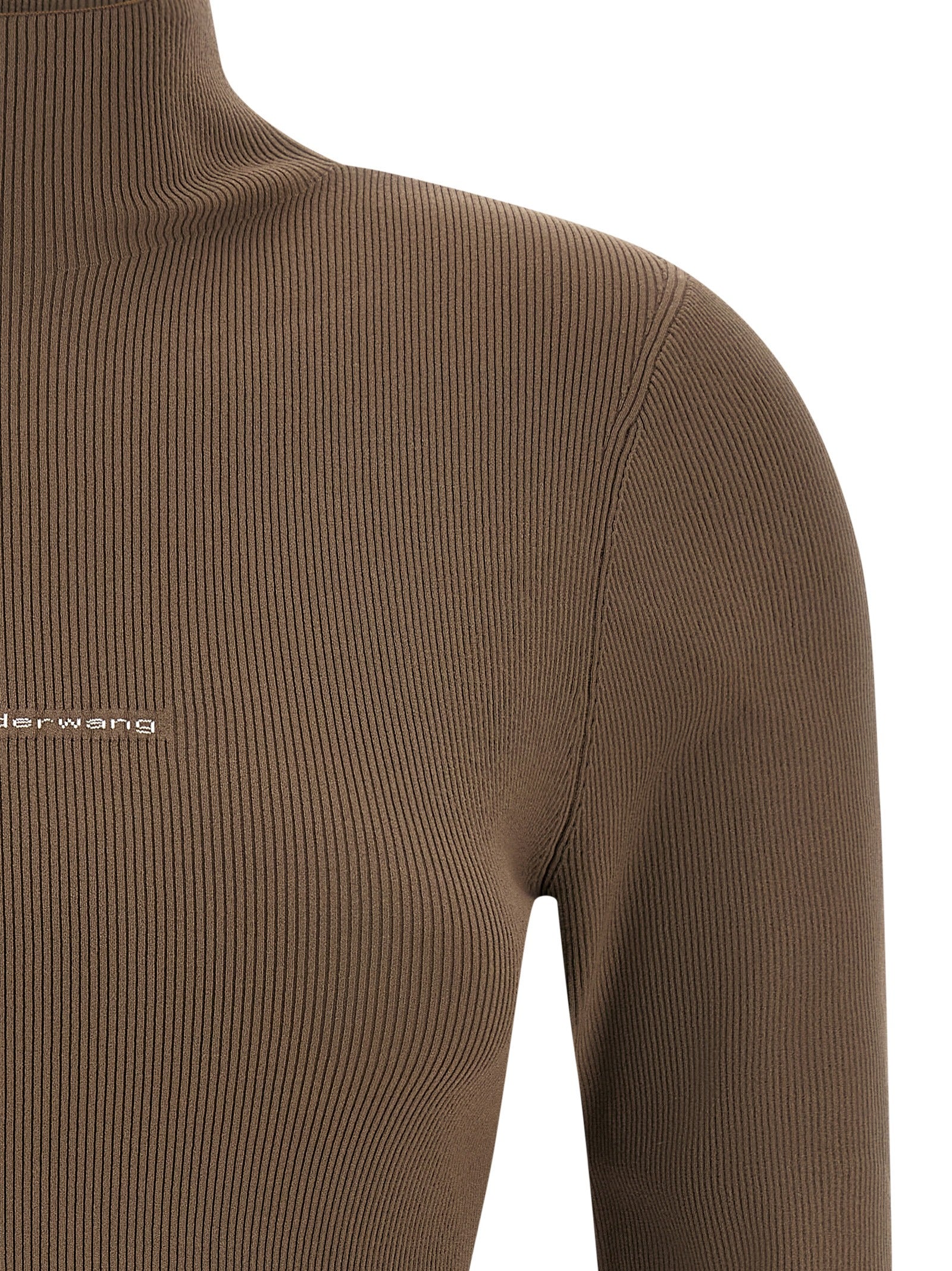 Indulge in the refined elegance of the Alexander Wang Beige Polyamide Cardigan, crafted from structured stretch yarn, embodying contemporary luxury and timeless sophistication.