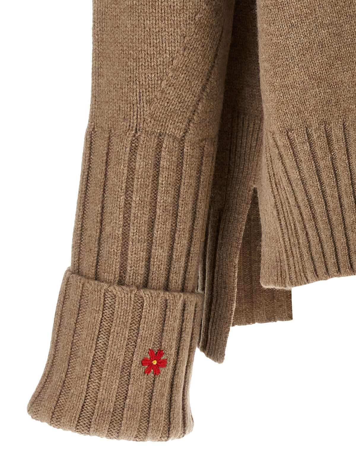 Elevate your wardrobe with the Tory Burch Beige Wool Cardigan, a masterpiece of artisanal craftsmanship in pure wool, perfect for timeless elegance and luxurious layering.