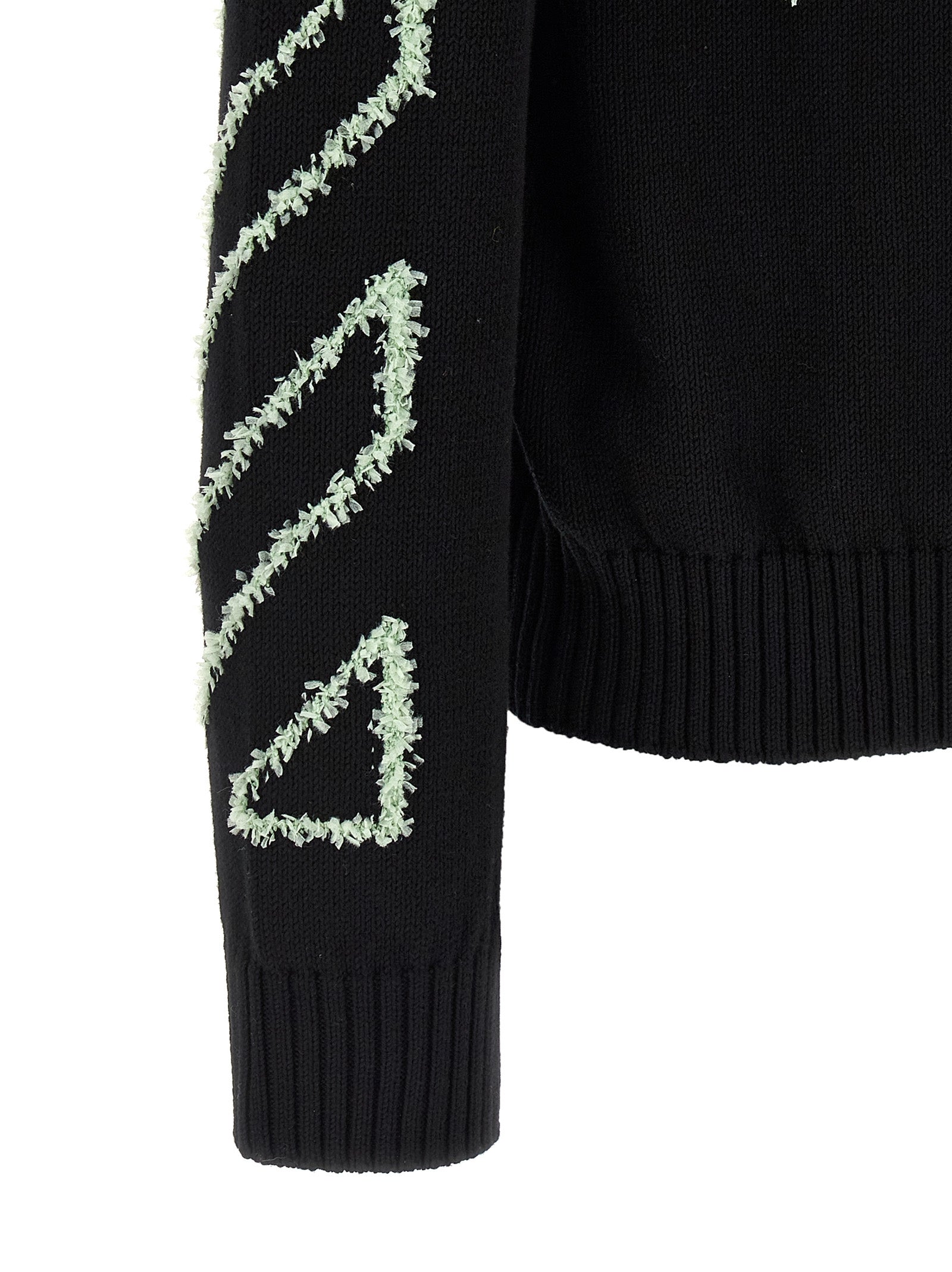 Indulge in the Off-White Black Cotton Cardigan, a masterpiece of Italian craftsmanship that merges luxury and comfort for a statement of effortless elegance.