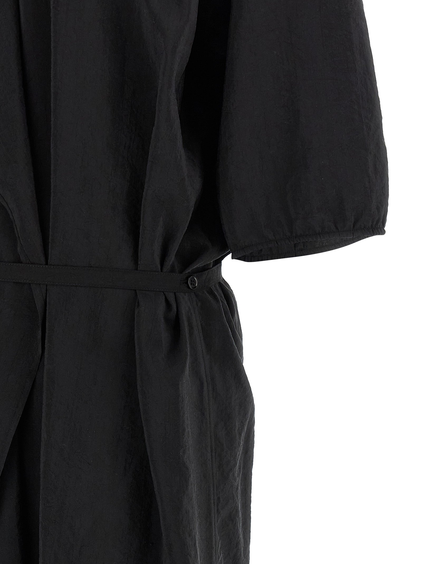 Elevate your wardrobe with the Lemaire Black Silk Midi Dress, a masterpiece of luxury-textured silk that embodies daring sophistication and timeless elegance.