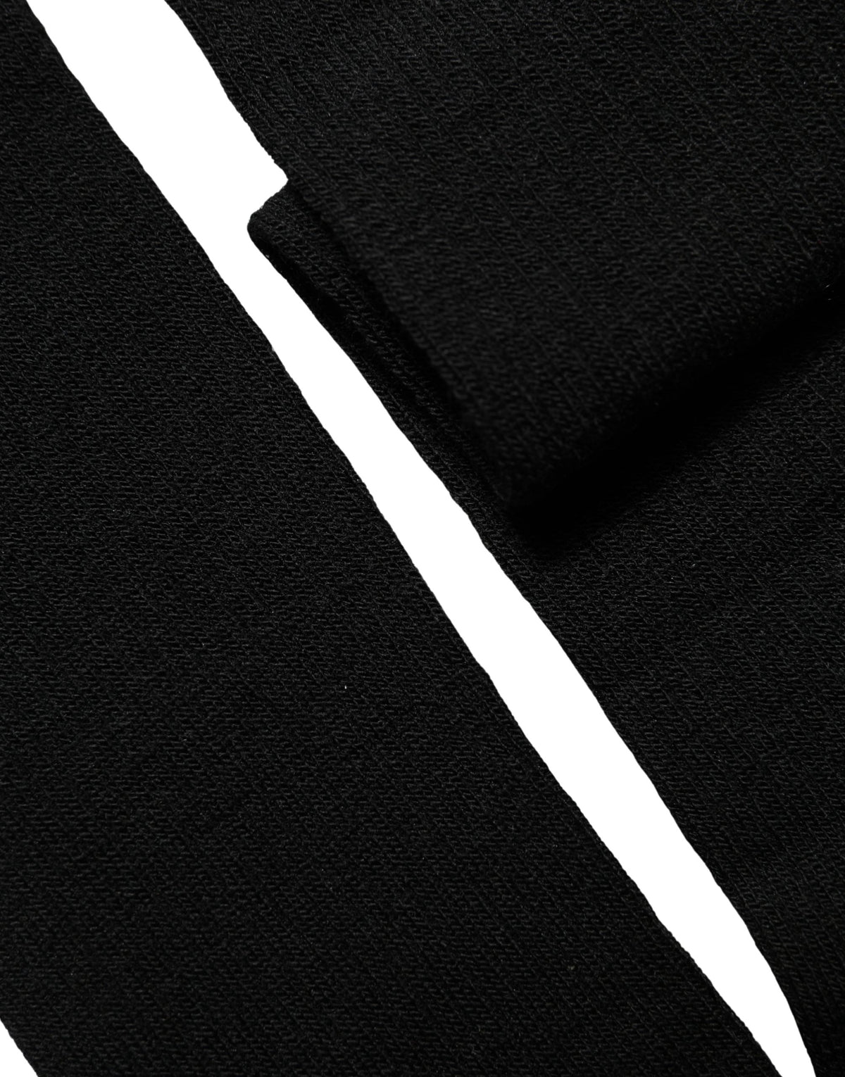 Elevate your style with Dolce & Gabbana's Black Wool Knit Calf Long Socks, crafted in Italy from a luxurious blend for unparalleled comfort and sophistication.
