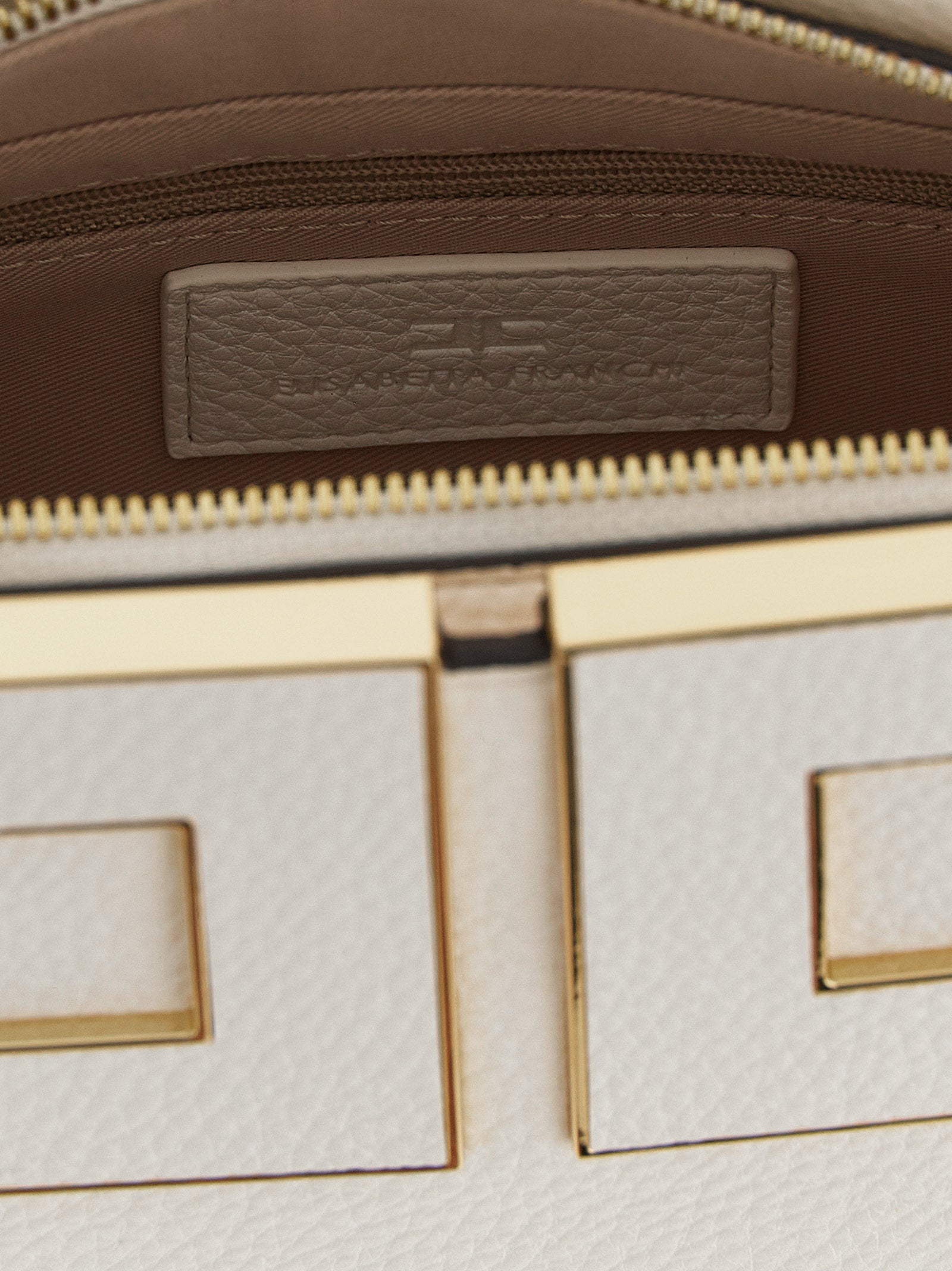 Elevate your elegance with the Elisabetta Franchi White Polyester Handbag, a masterpiece of luxurious craftsmanship and timeless sophistication, perfect for any occasion.