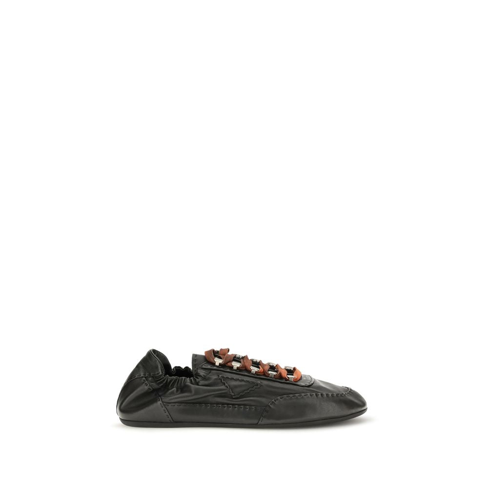 Experience the allure of Prada Black Lamb Ovis Aries Aries Athletic Sneakers, crafted from luxurious aged nappa leather, embodying sophistication and modern elegance for the discerning individual.