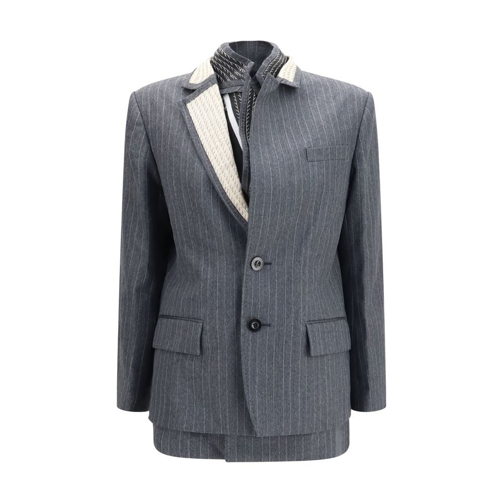 Indulge in the Sacai Gray Wool Oves Aries Jacket, a masterpiece of pinstripe elegance crafted from 100% luxurious wool, perfect for the discerning fashion connoisseur.