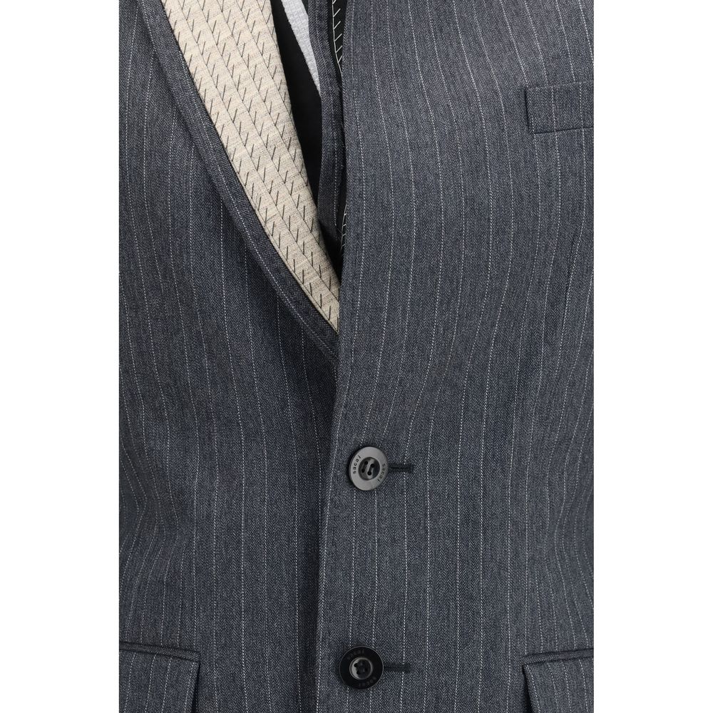 Elevate your wardrobe with the Sacai Gray Wool Oves Aries Jacket, a masterpiece of 100% wool craftsmanship that embodies timeless elegance and versatile sophistication.