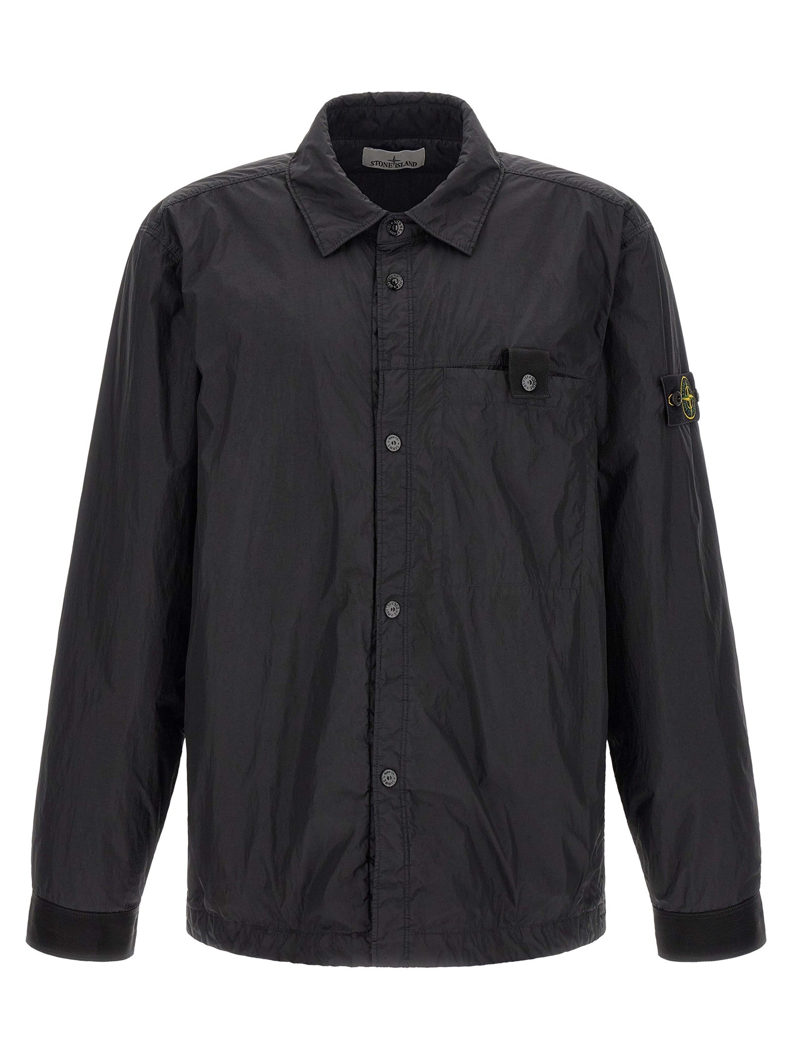 Indulge in the elegance of the Stone Island Black Polyamide Shell Jacket, a masterful blend of luxury and sustainability, crafted for those who command attention.