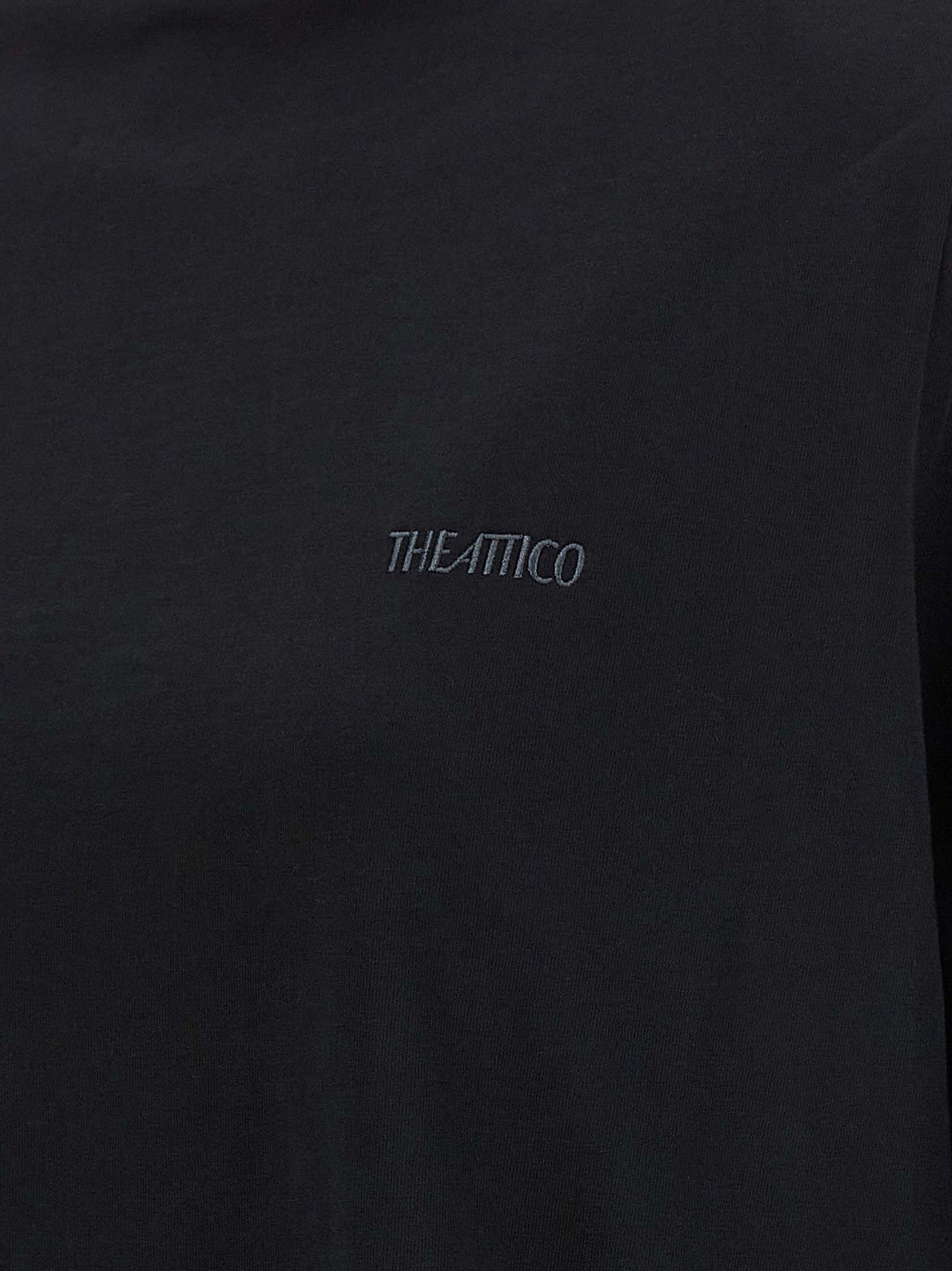Discover the elegance of The Attico Black Cotton T-Shirt, a luxurious blend of comfort and sophistication, perfect for redefining your wardrobe essentials.