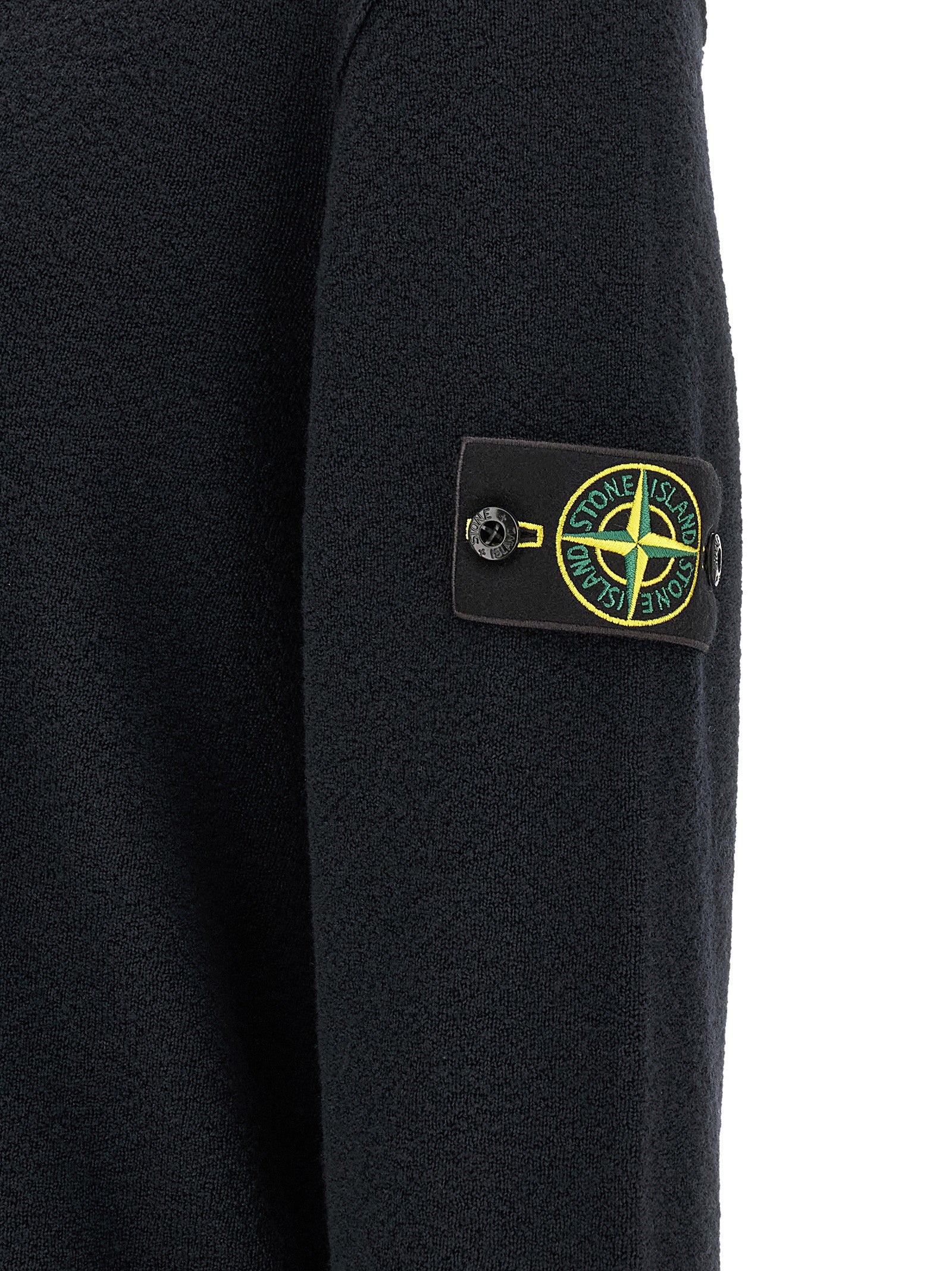 Elevate your style with the Stone Island Blue Virgin Wool Cardigan, a masterpiece of craftsmanship in pure virgin wool, embodying luxury and sophistication for discerning tastes.