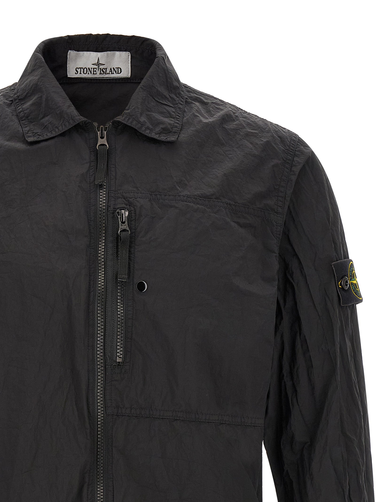 Discover the Stone Island Black Polyamide Blouse, a sustainable luxury piece crafted from ECONYL® yarn, merging chic elegance with eco-conscious design for the discerning wardrobe.