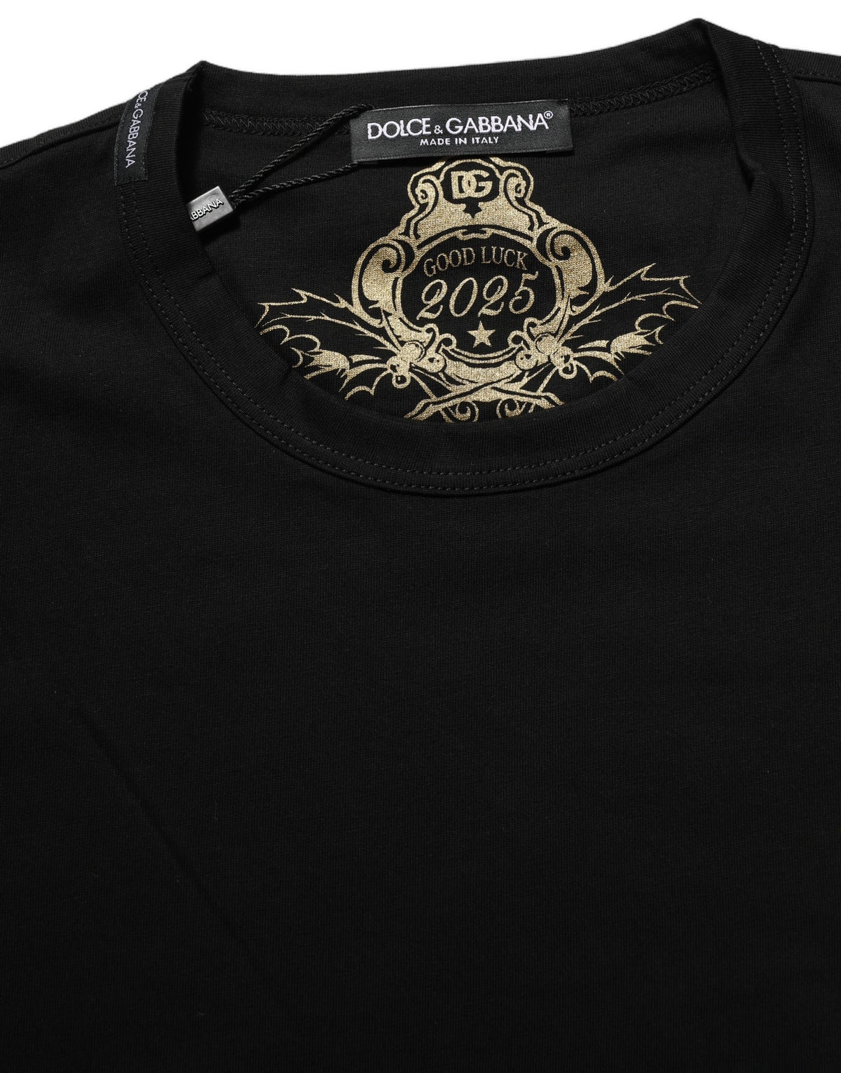 Elevate your wardrobe with the Dolce & Gabbana Black Cotton Crew Neck T-shirt, crafted in Italy from 100% cotton, embodying timeless elegance and exquisite craftsmanship.