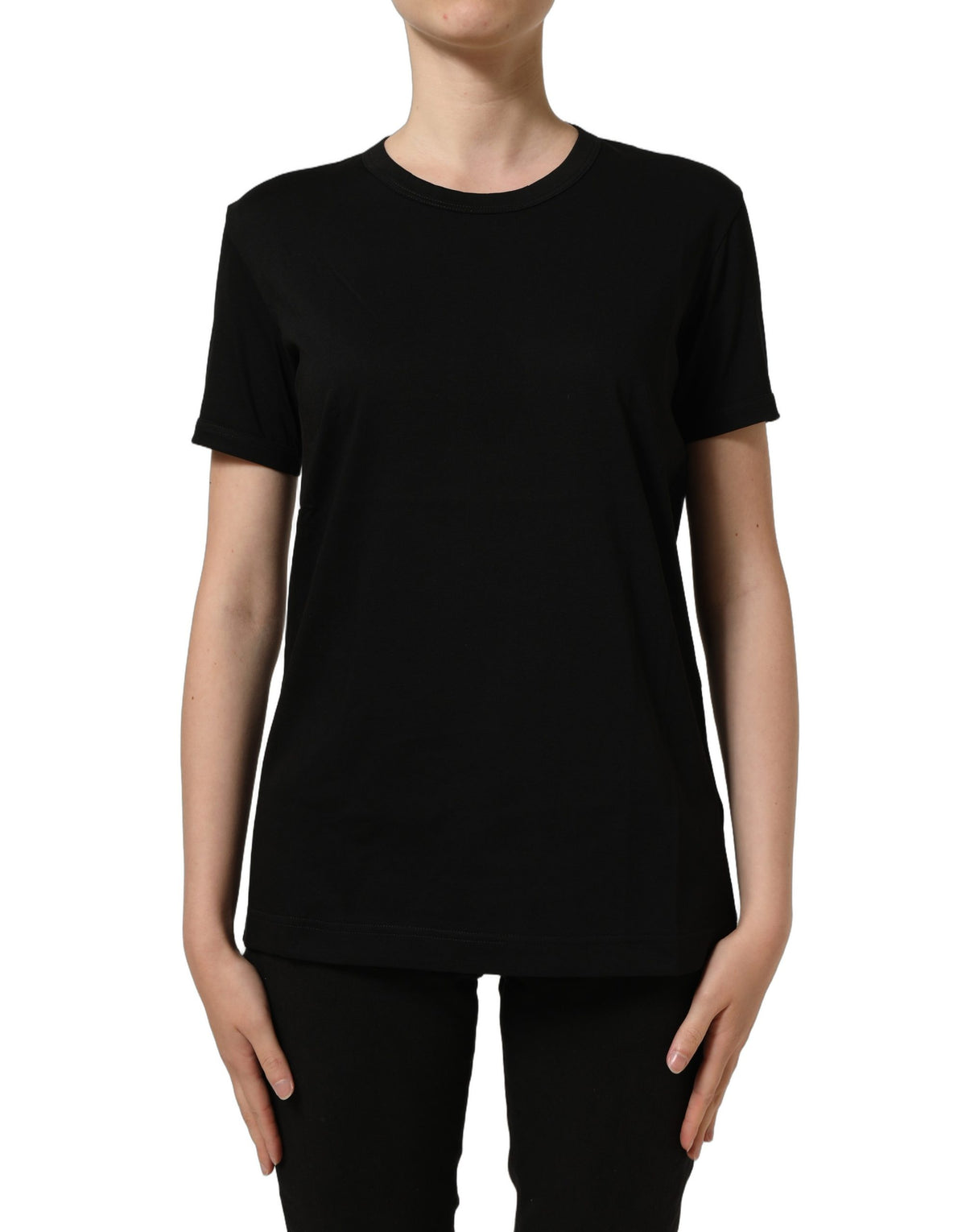 Indulge in the elegance of Dolce & Gabbana's Black Cotton Crew Neck T-shirt, crafted in Italy from 100% cotton, a timeless staple for the discerning wardrobe.