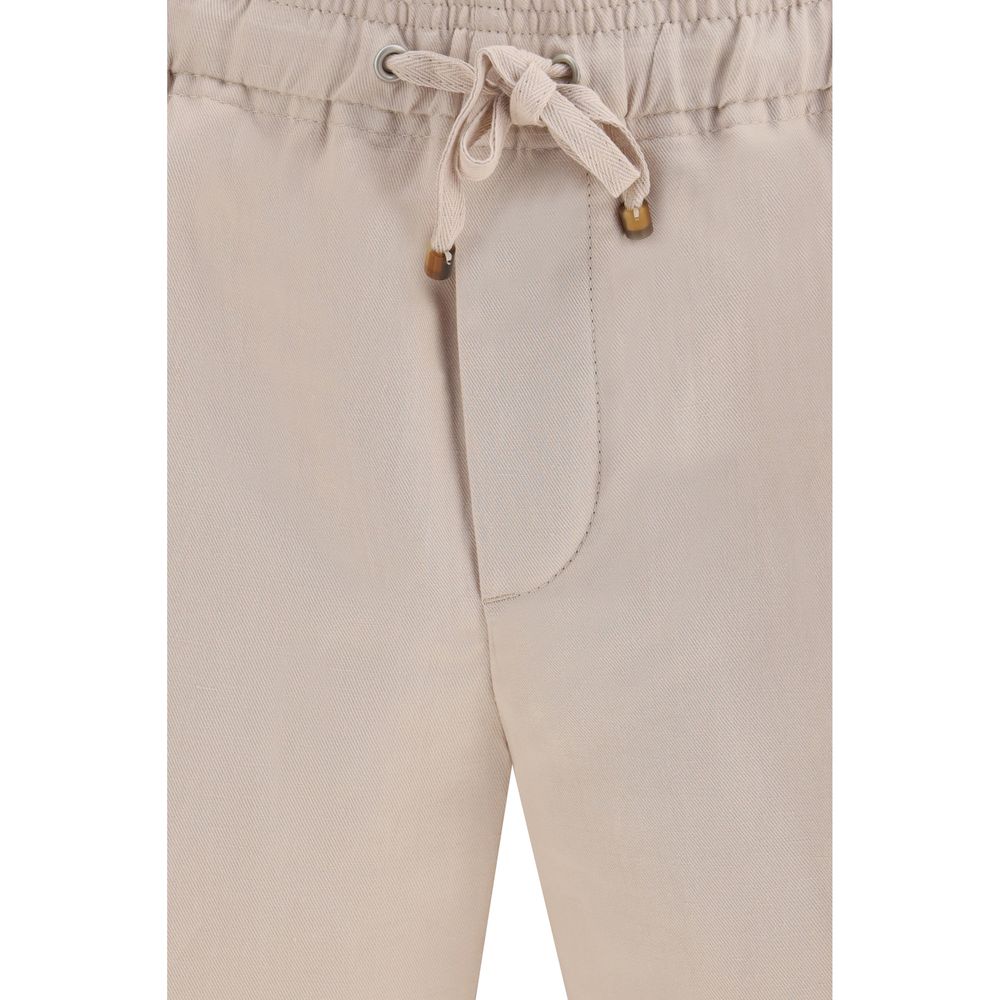 Indulge in the luxury of Brunello Cucinelli Beige Linen Bermuda Shorts, crafted from a premium linen-cotton blend for effortless elegance and timeless style.