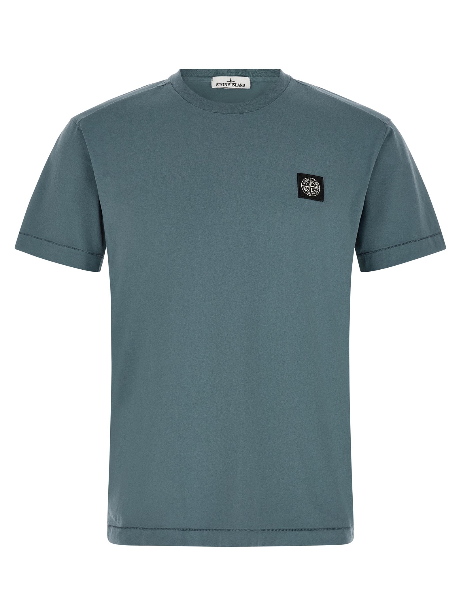 Elevate your style with the Stone Island Blue Cotton T-Shirt, crafted from luxurious garment-dyed cotton, embodying sophistication and timeless elegance for discerning tastes.