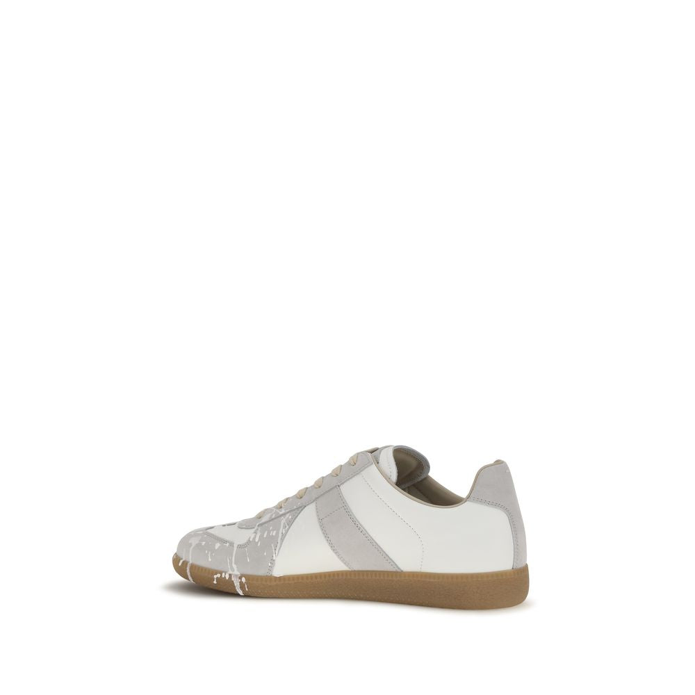 Indulge in the Maison Margiela Gray Suede Leather Low Top Sneakers, where exquisite craftsmanship meets contemporary elegance, perfect for the discerning individual.